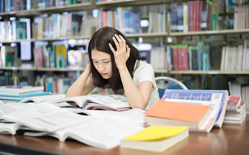 Stressed student struggling with academics and low self-esteem.