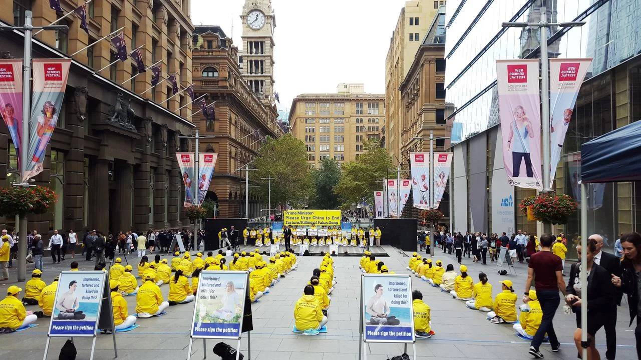 Falun Gong practitioners raise awareness in Martin Place, Sydney.