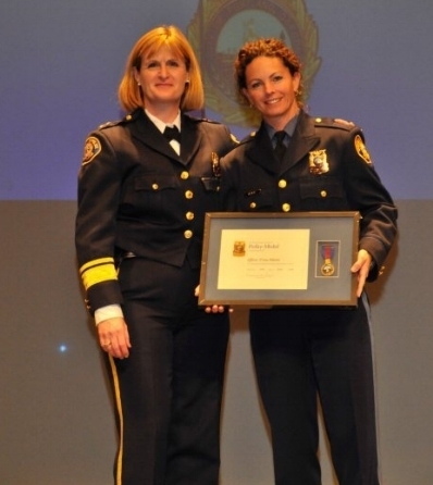 Chief Rosie Sizer awarding me the Police Medal in 2009.