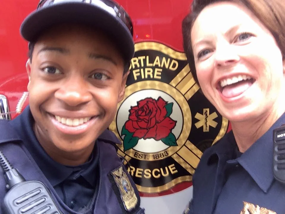My friend Rashida and I having a little fun photo bombing the fire guys.