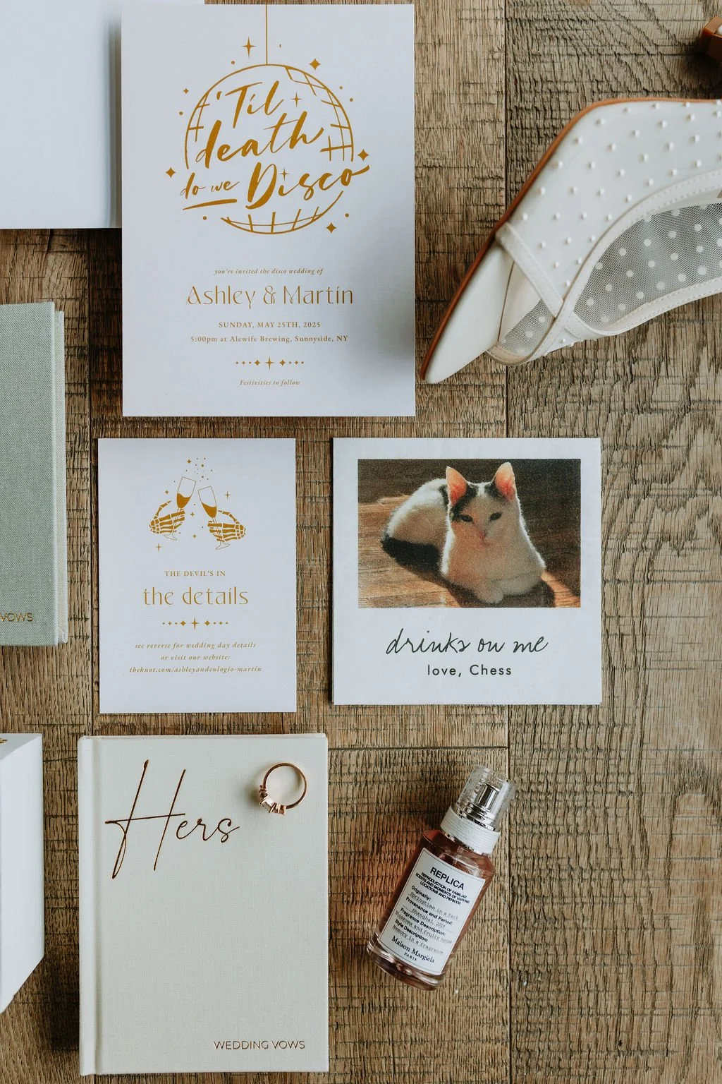 Wedding invitation suite with gold accents and a photo of a cat. The main invite says 'Til death do we Disco' and features a graphic of a disco ball. There are additional cards with celebratory graphics and a humorous card with a cat and the caption 