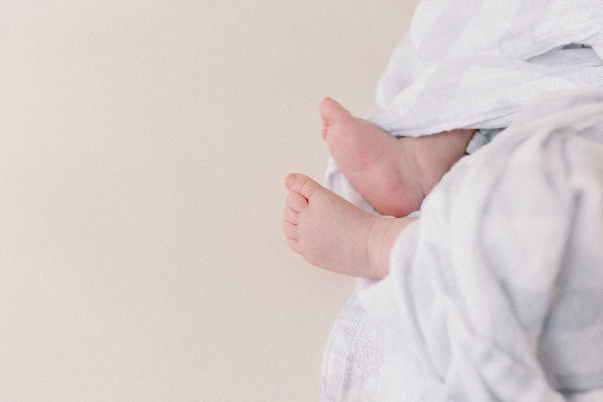 baby feet details in natural light studio by Phoenix newborn photographer
