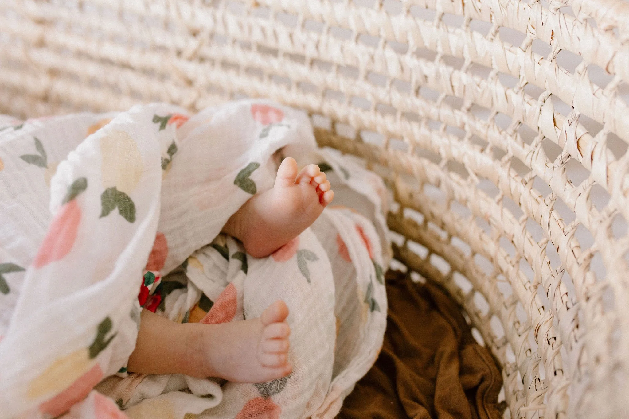 close-up photo of newborn baby feet and toes
