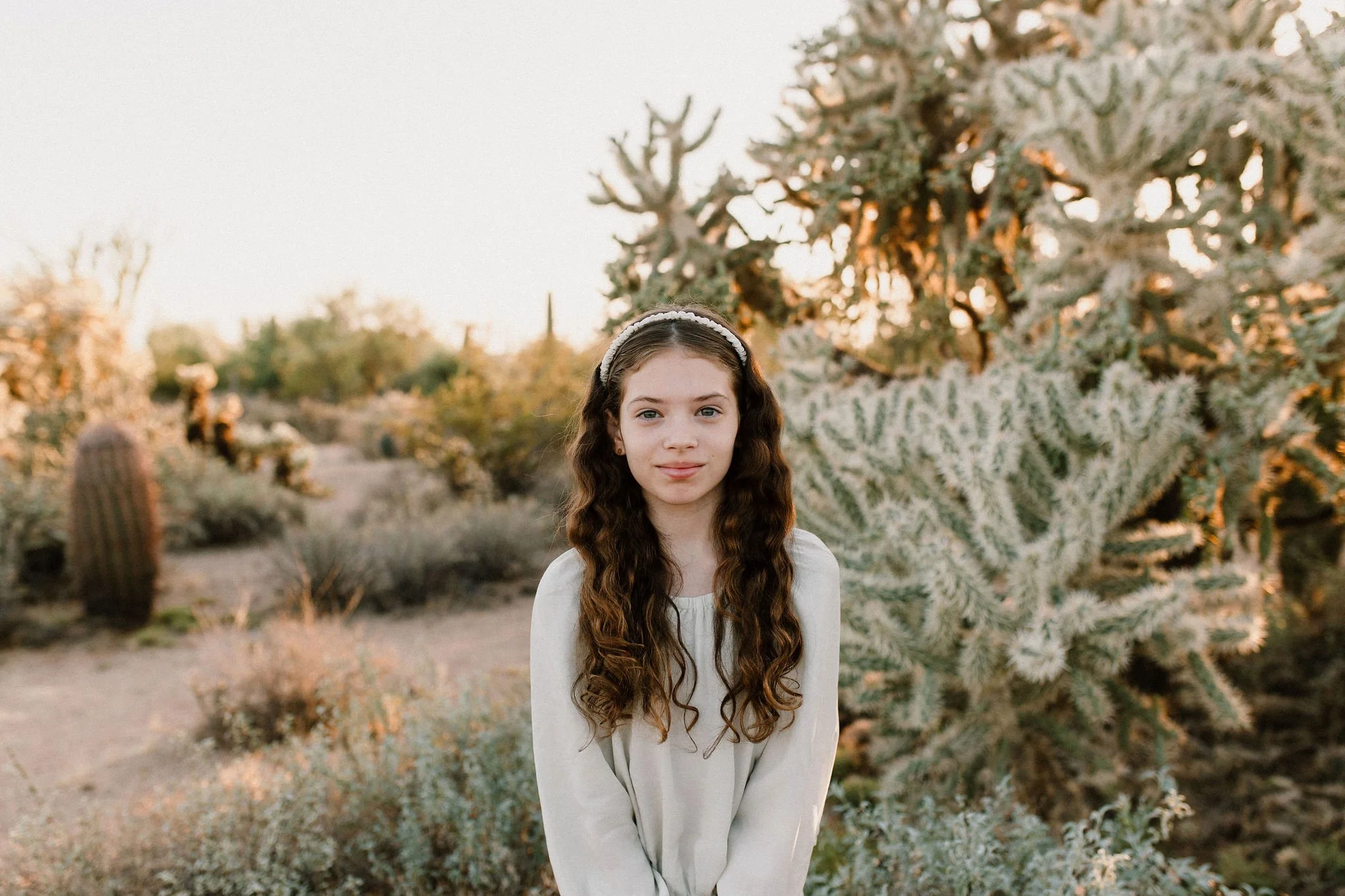 daughter smiling in the Arizona desert taken by Mesa family photographer