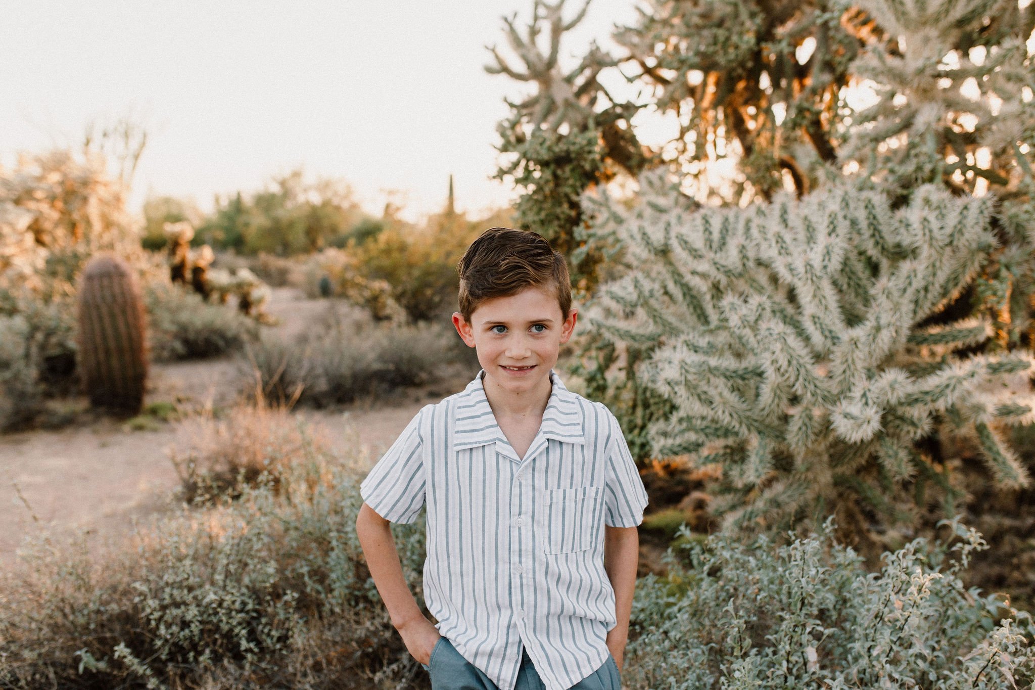 boy smiling in Arizona desert captured by Mesa family photographer