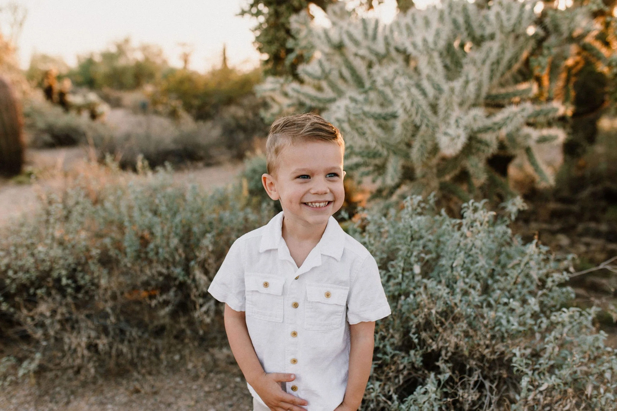 toddler laughing in Arizona desert captured by Mesa family photographer
