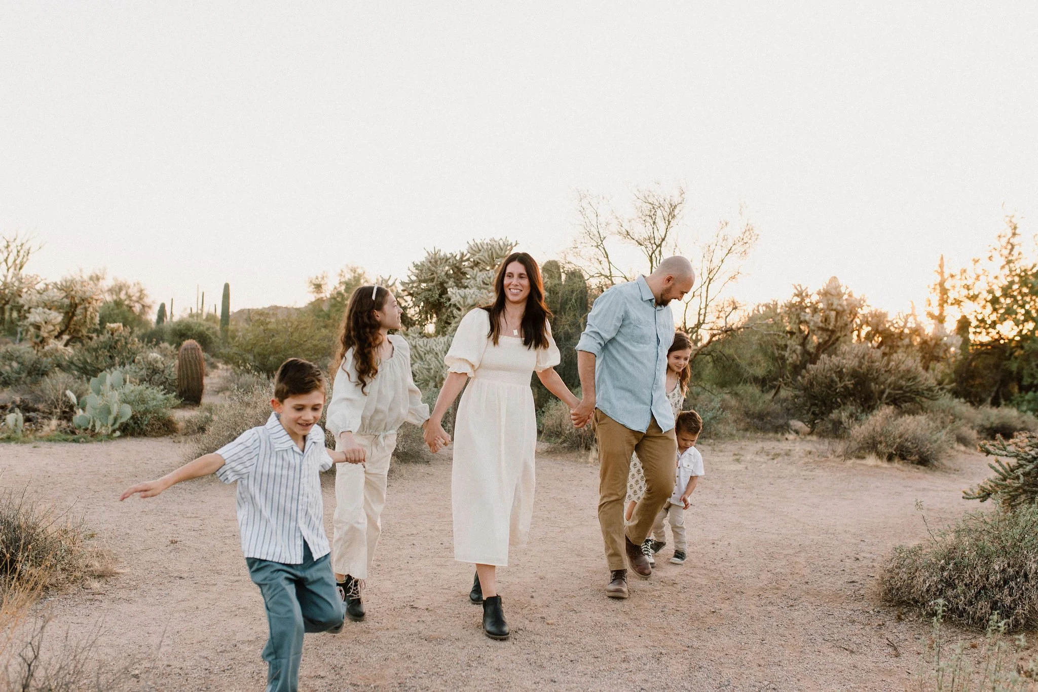 family holding hands in the desert golden hour photoshoot in Gilbert AZ