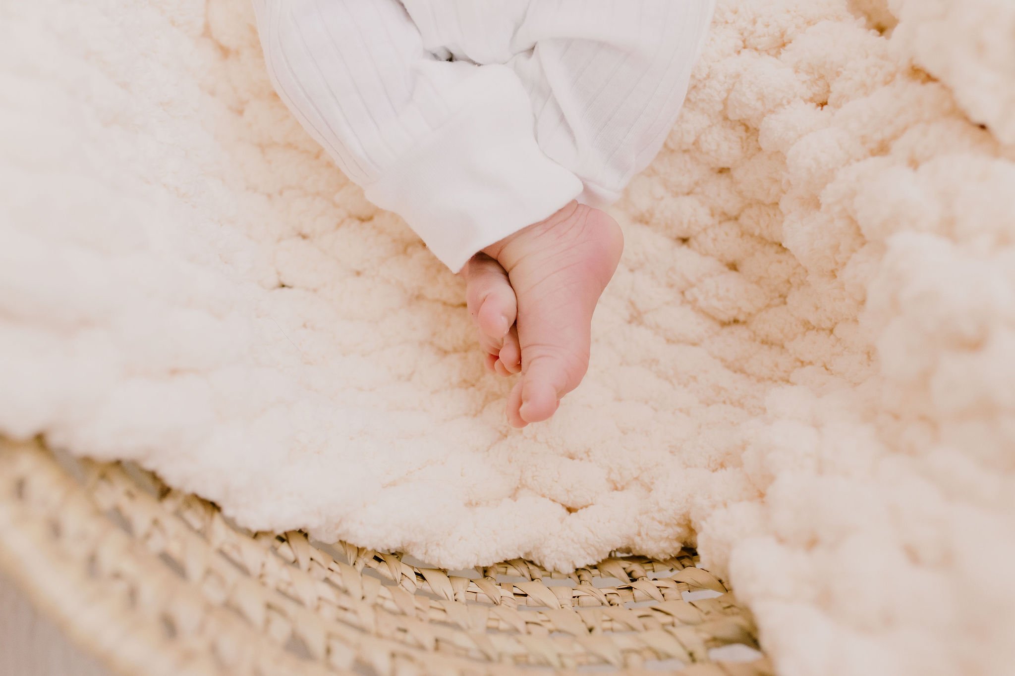 close-up detail photo of baby feet and toes in studio newborn photography session