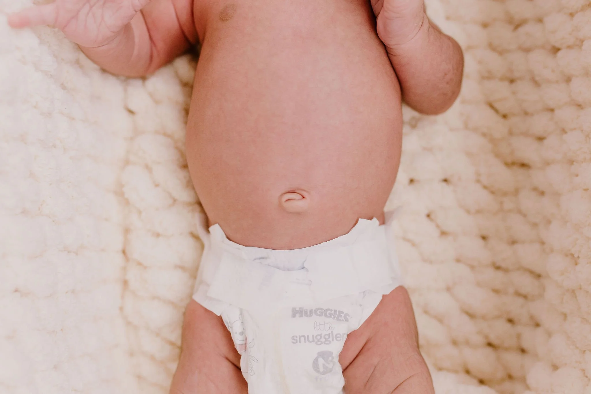 close-up detail photo of baby belly button in studio newborn photography session