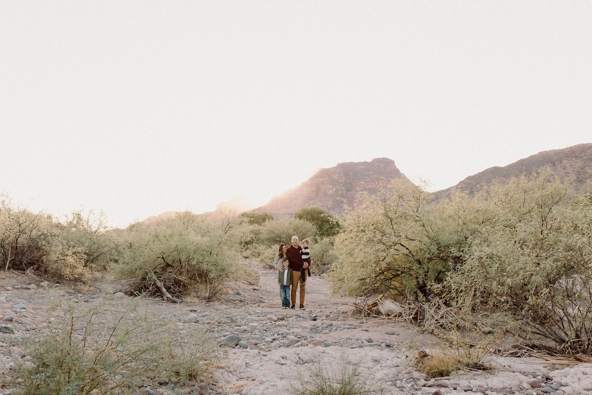 family standing together in desert by the Salt River in Arizona