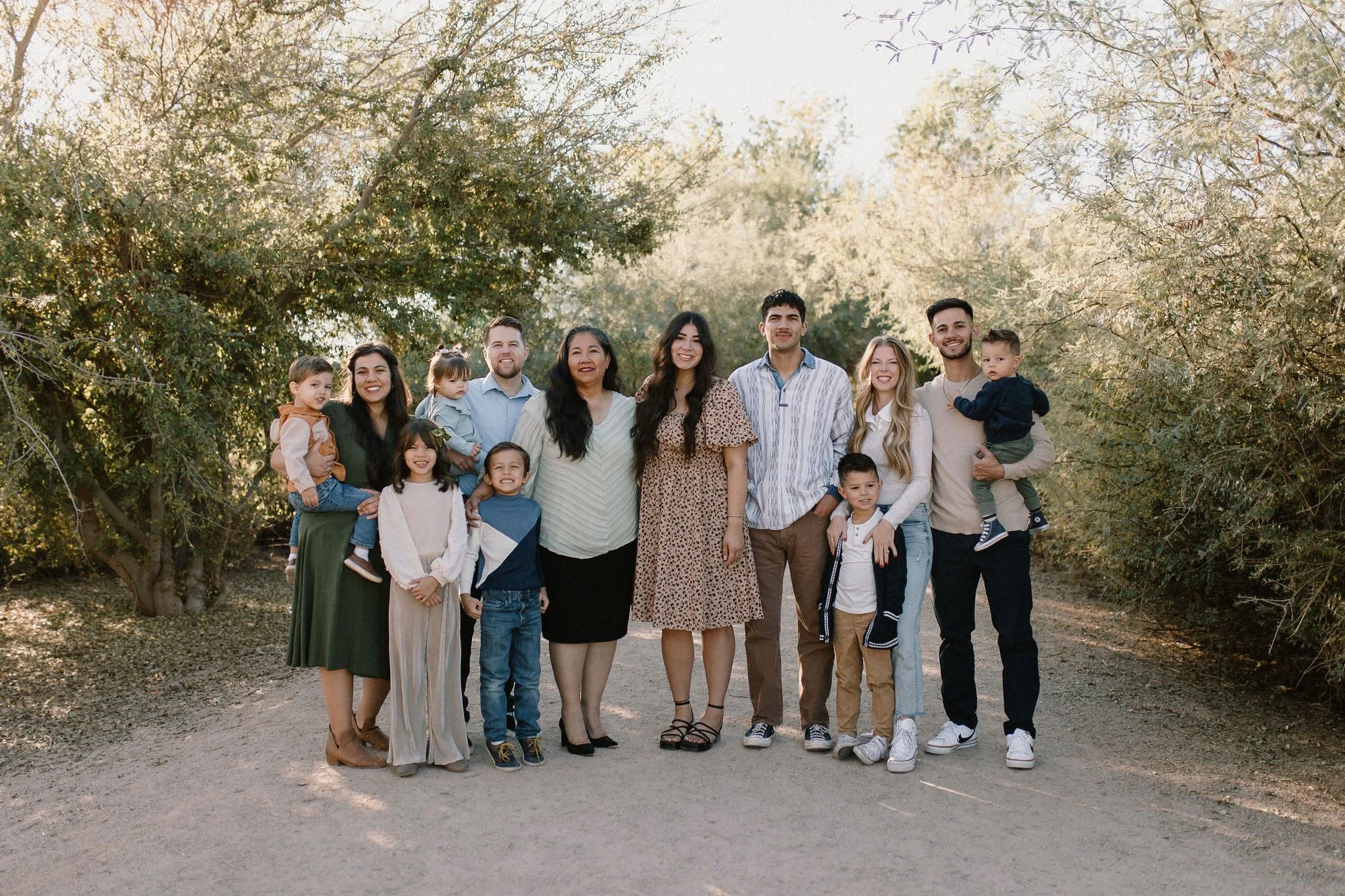 family standing and smiling during extended family photography session