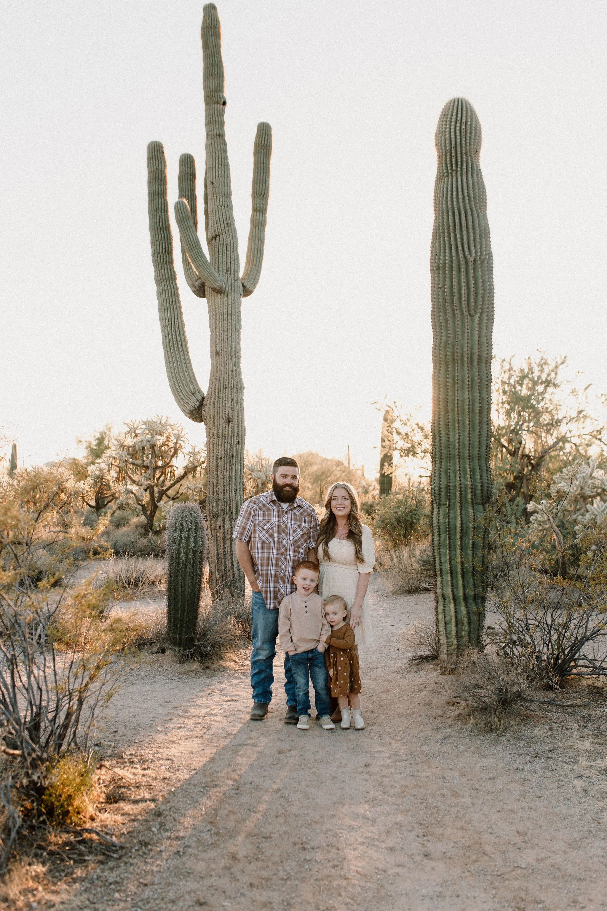 family standing together smiling in desert photography session at Usery Mountain in Arizona
