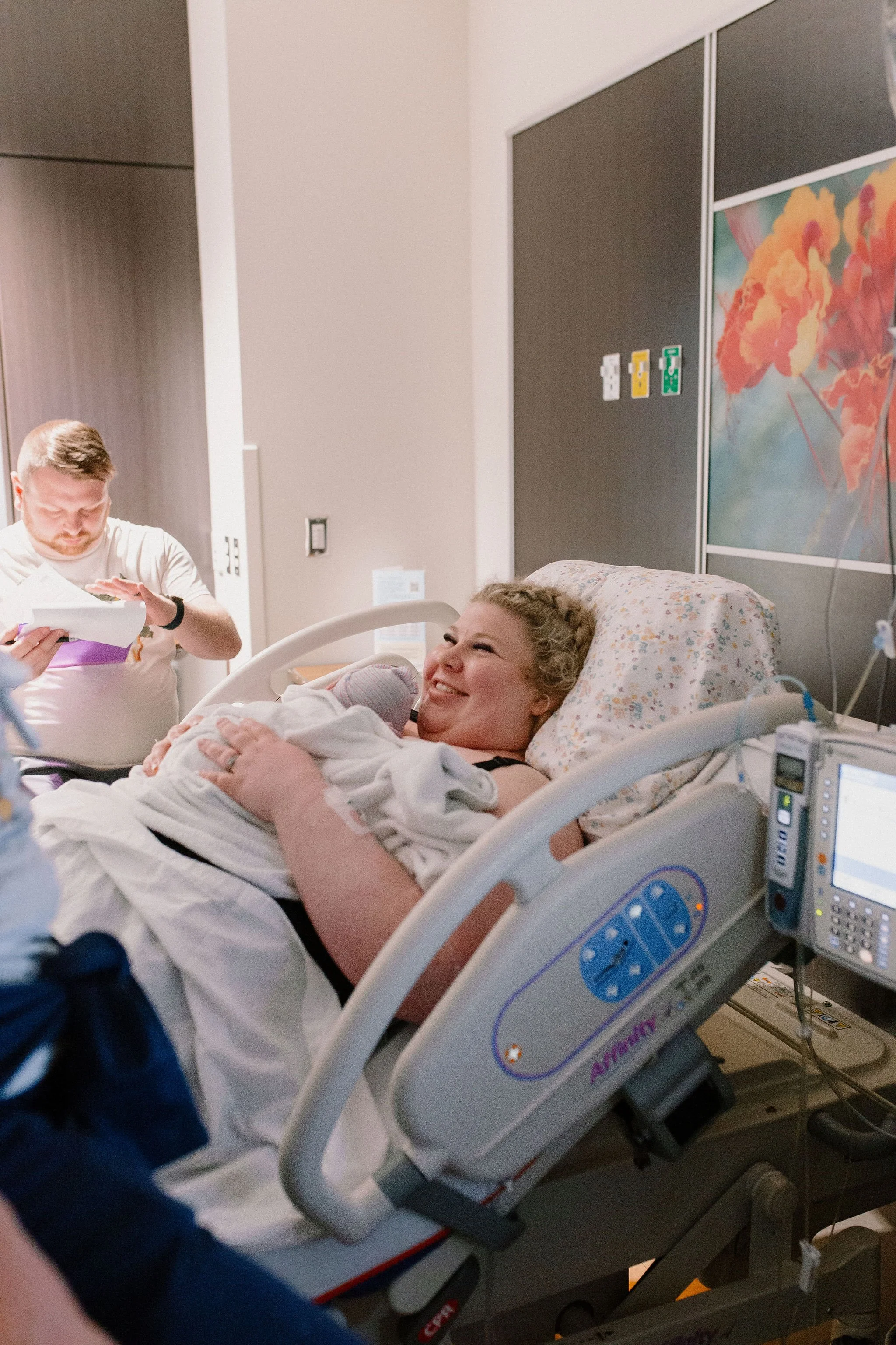 mom holding newborn baby immediately after delivery captured by Mesa birth photographer