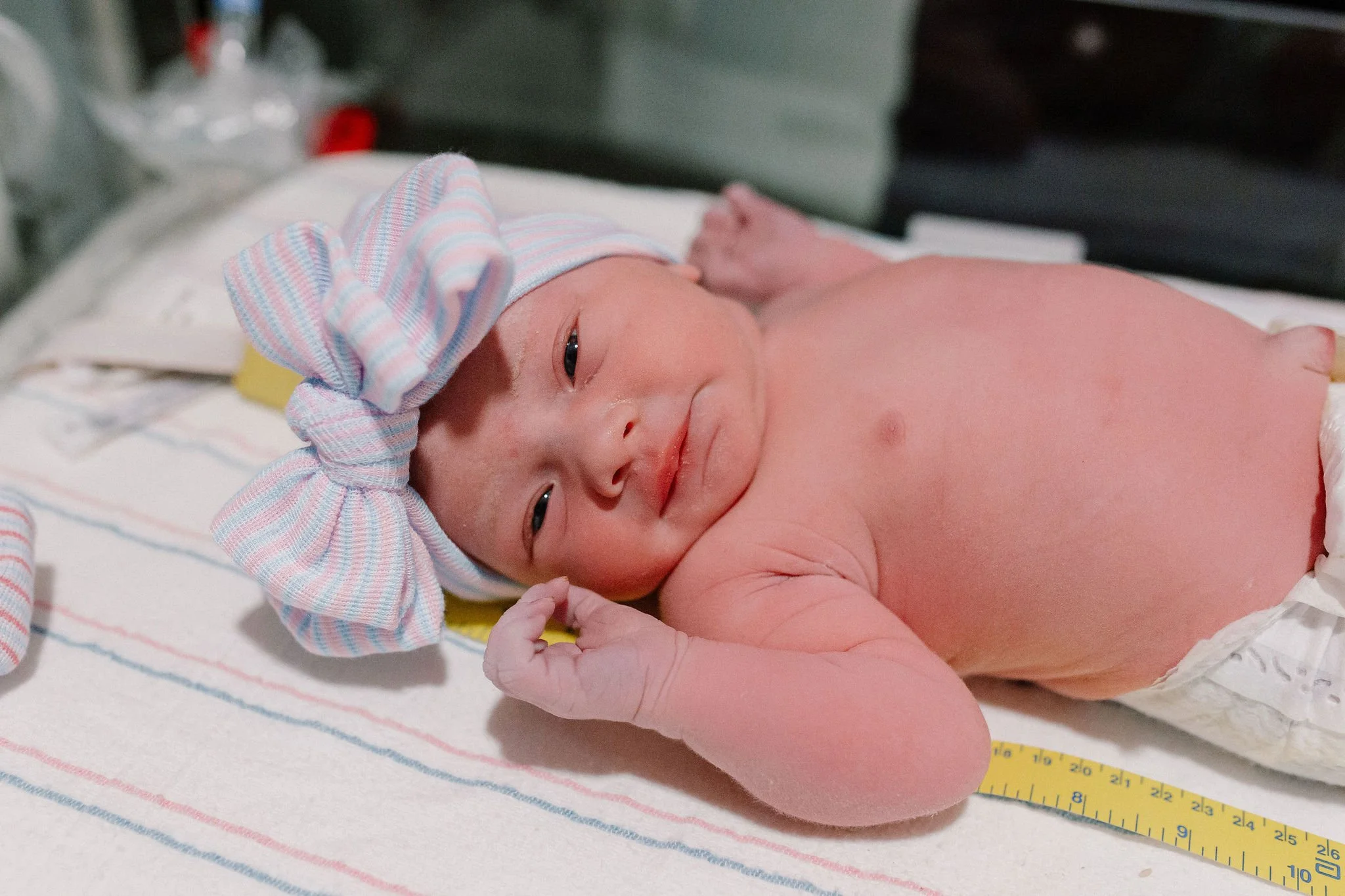 newborn baby in warmer during hospital birth photography