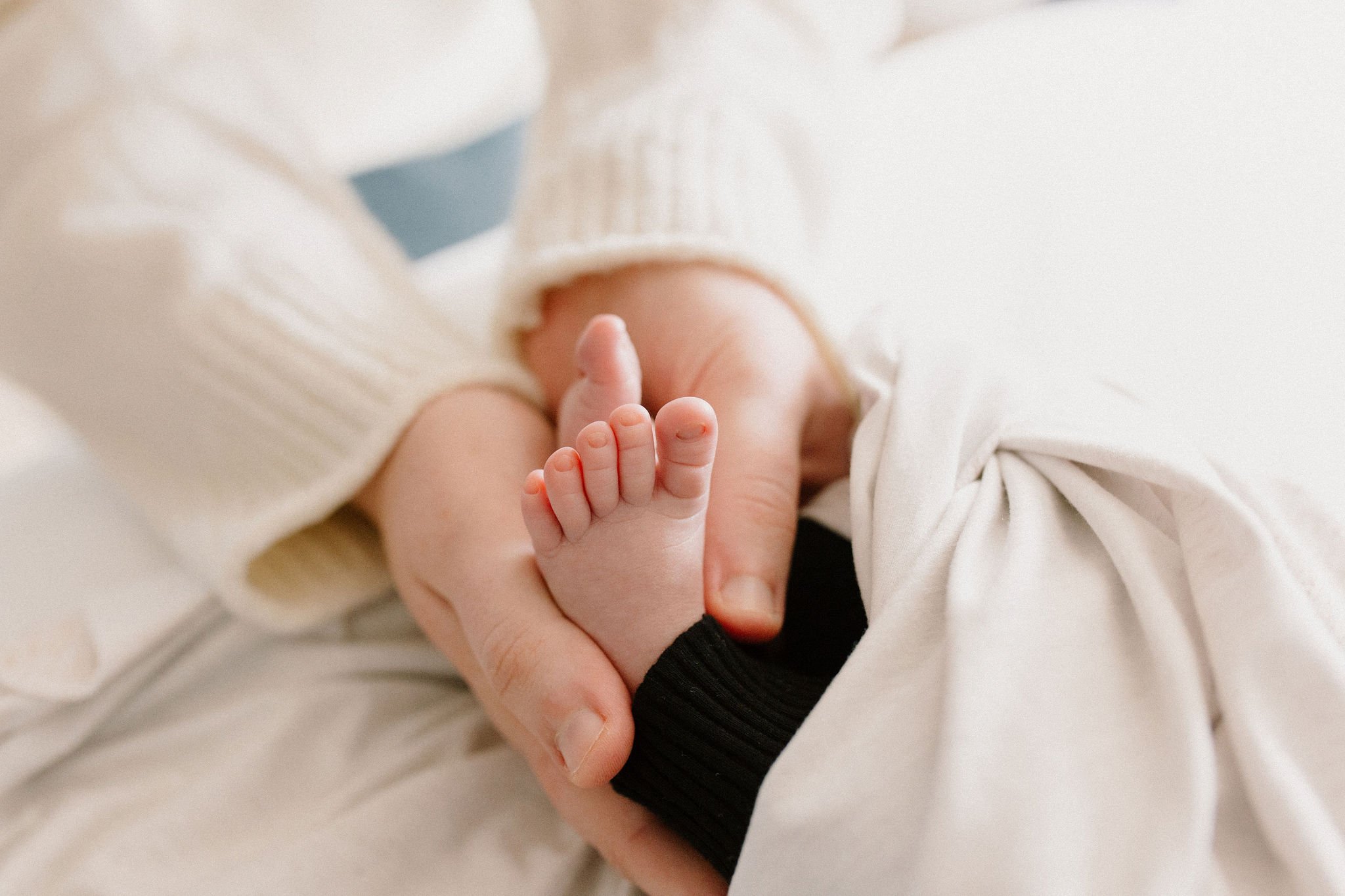 mom holding baby's feet newborn details photography in-home Gilbert, Arizona