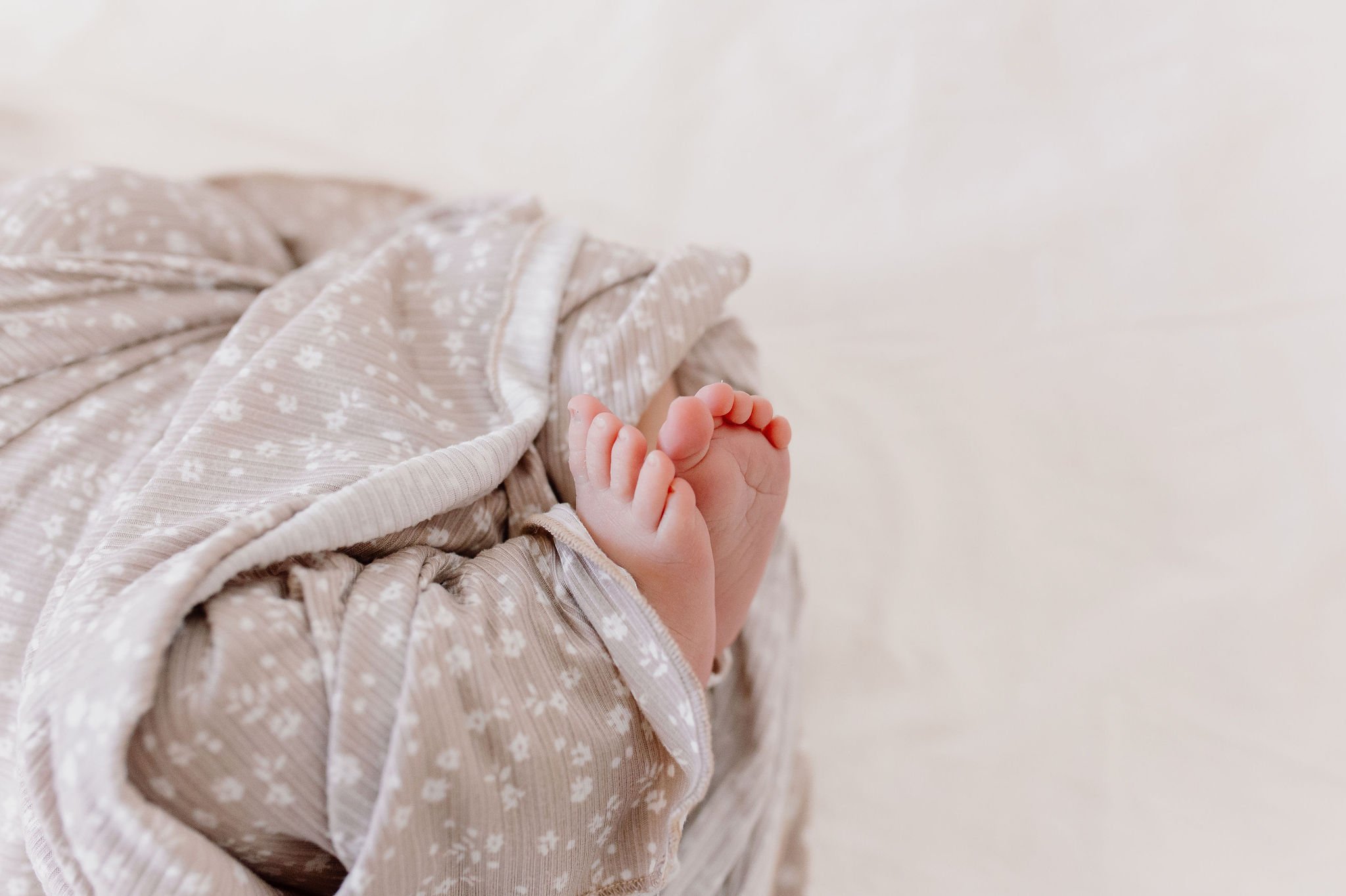 close up detail shot of newborn baby feet and toes