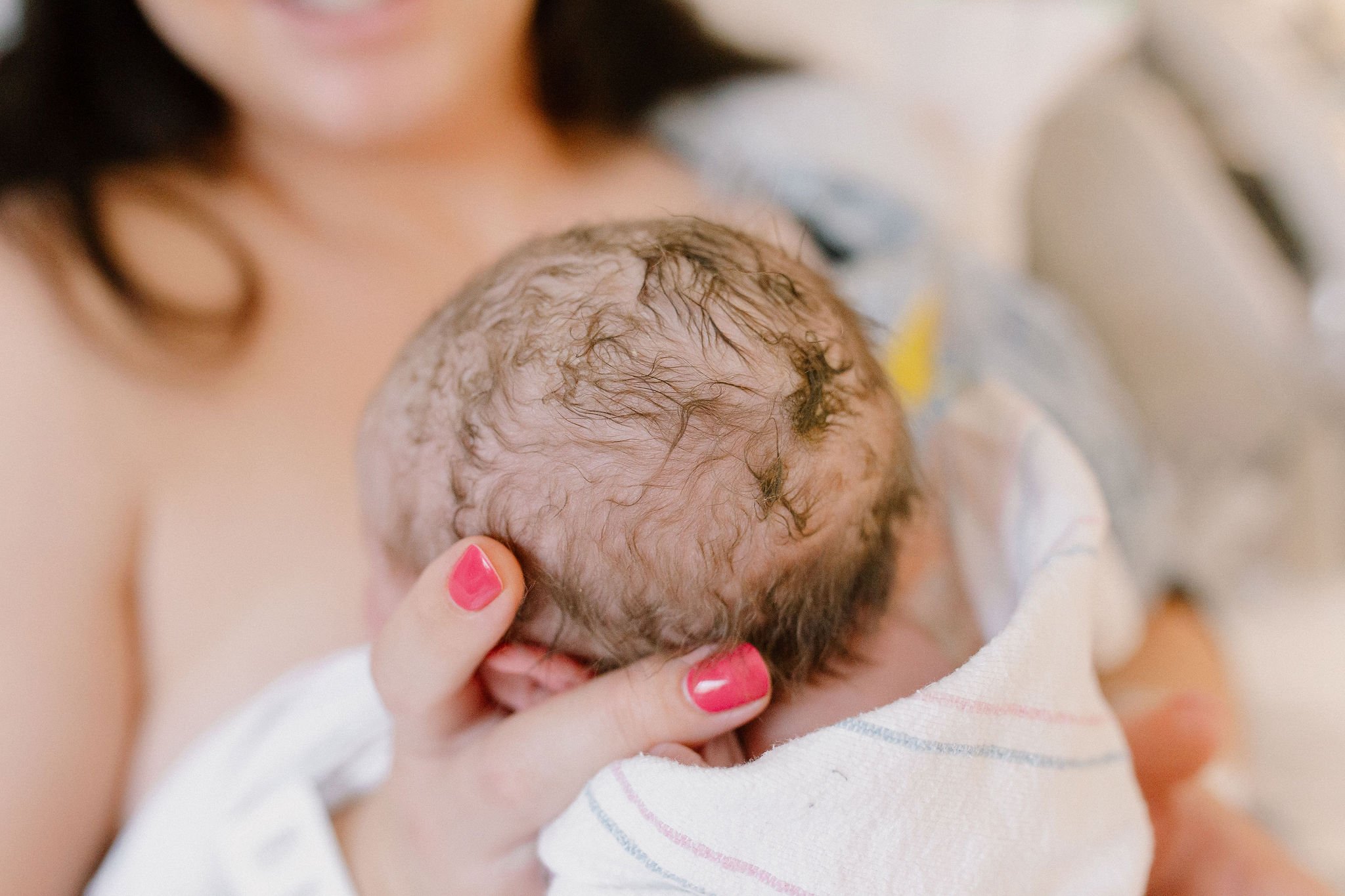 close up detail photo of newborn baby hair after birth