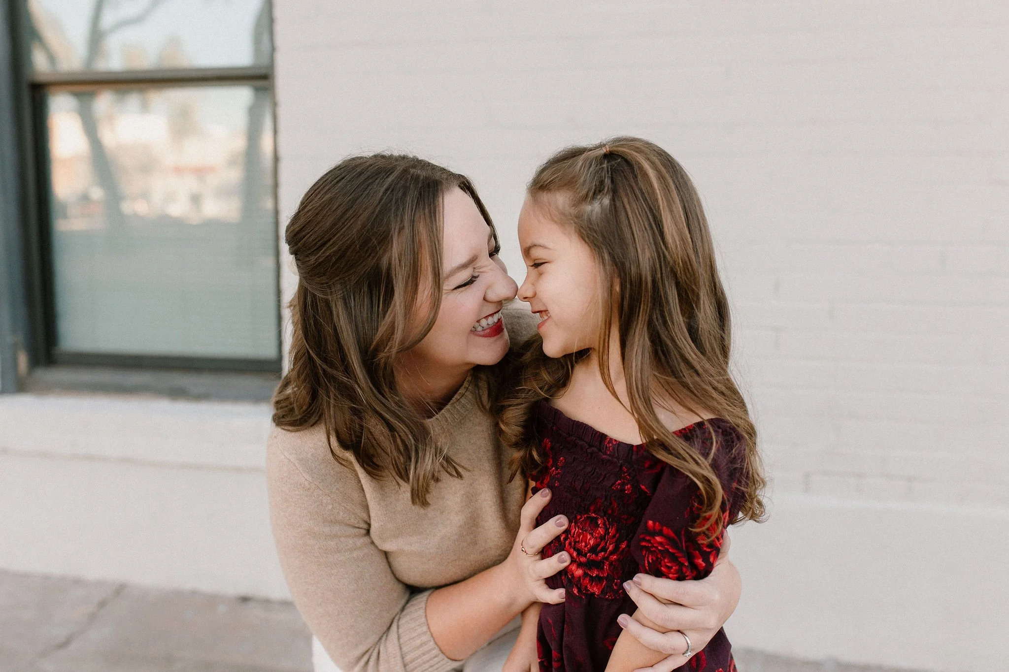 mother daughter portrait looking at each other during downtown mesa family photos
