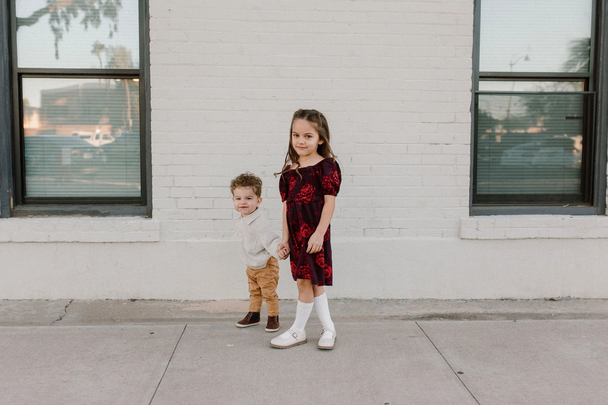 siblings holding hands in downtown mesa family photography session