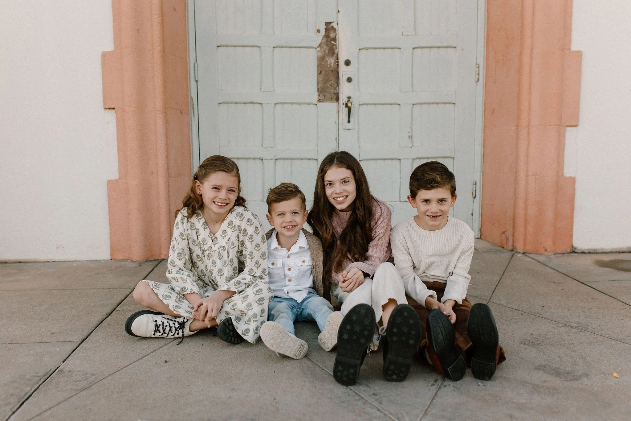 siblings sitting together during extended family photography session