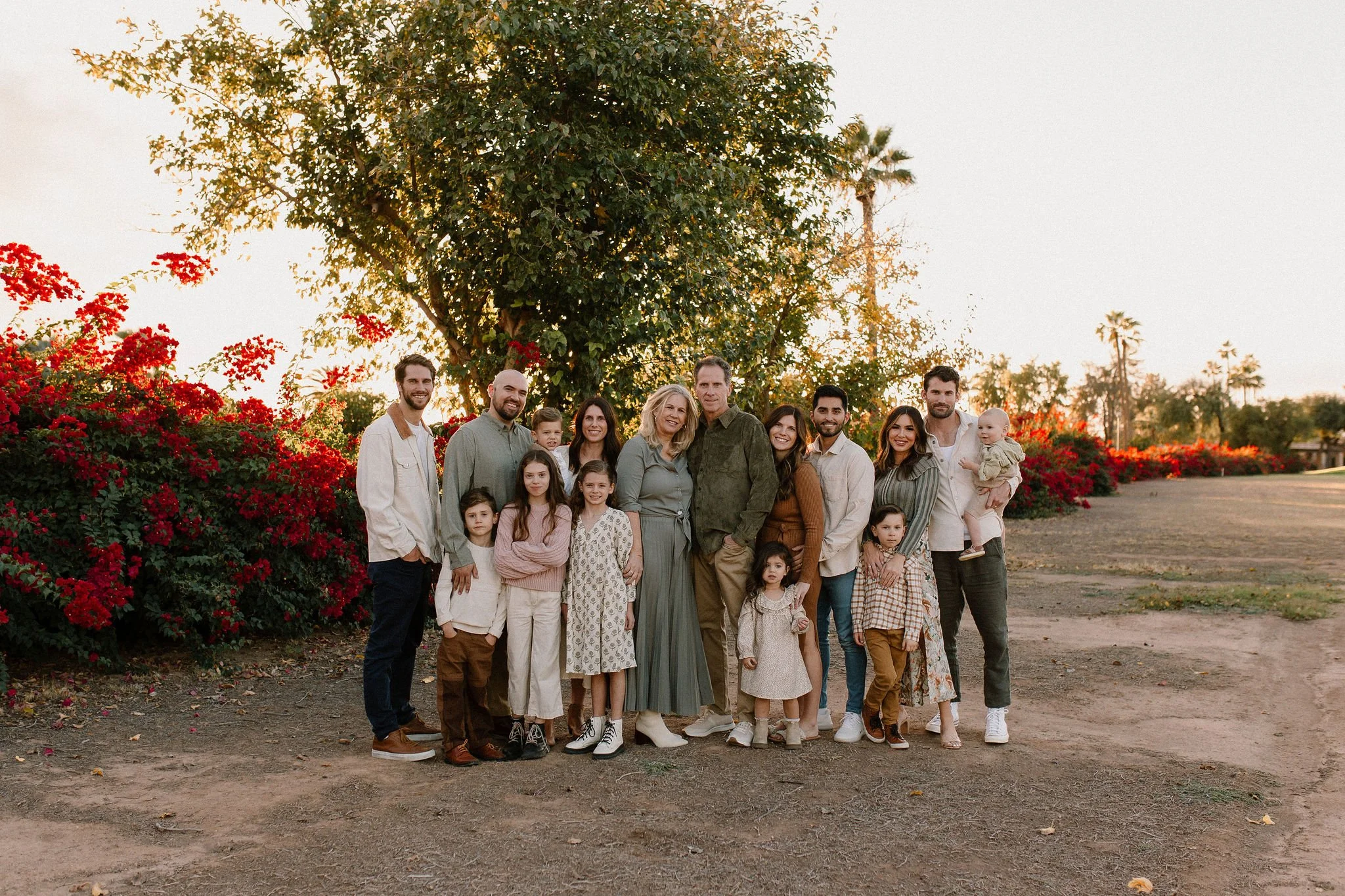 extended family standing together and smiling during family photo session