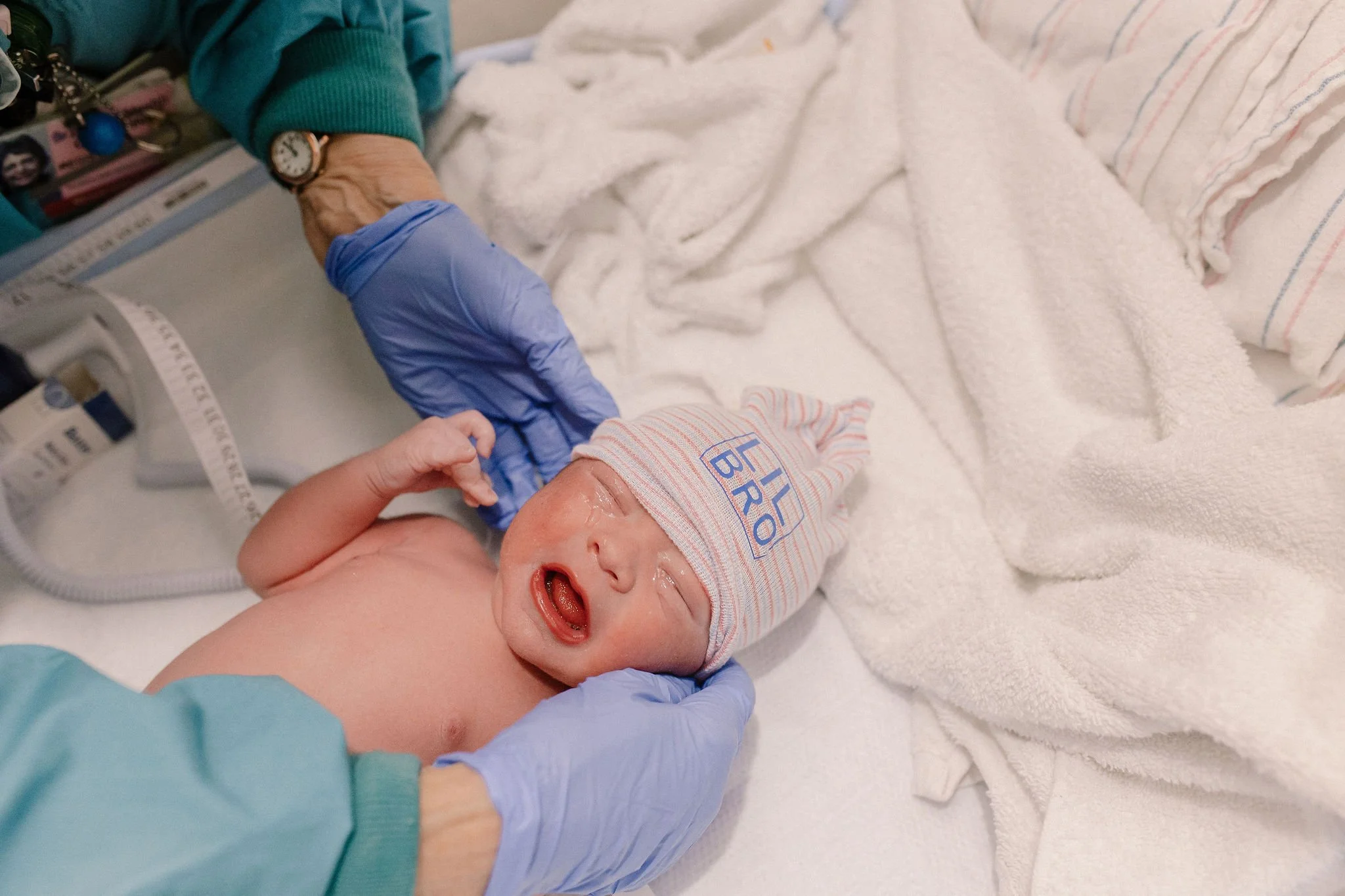 newborn baby in warmer hospital birth photography