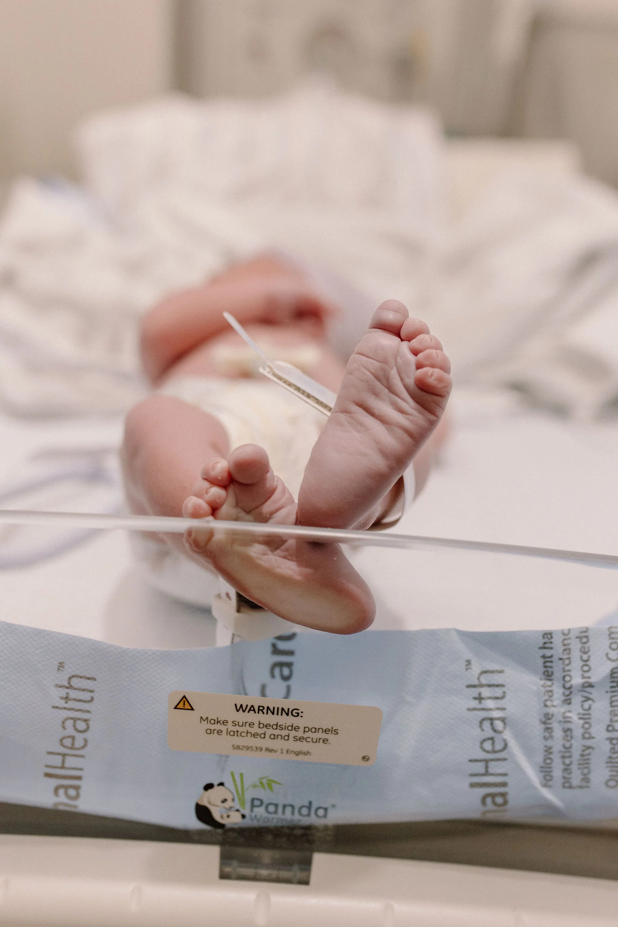 newborn baby feet and toes details in hospital birth photography session