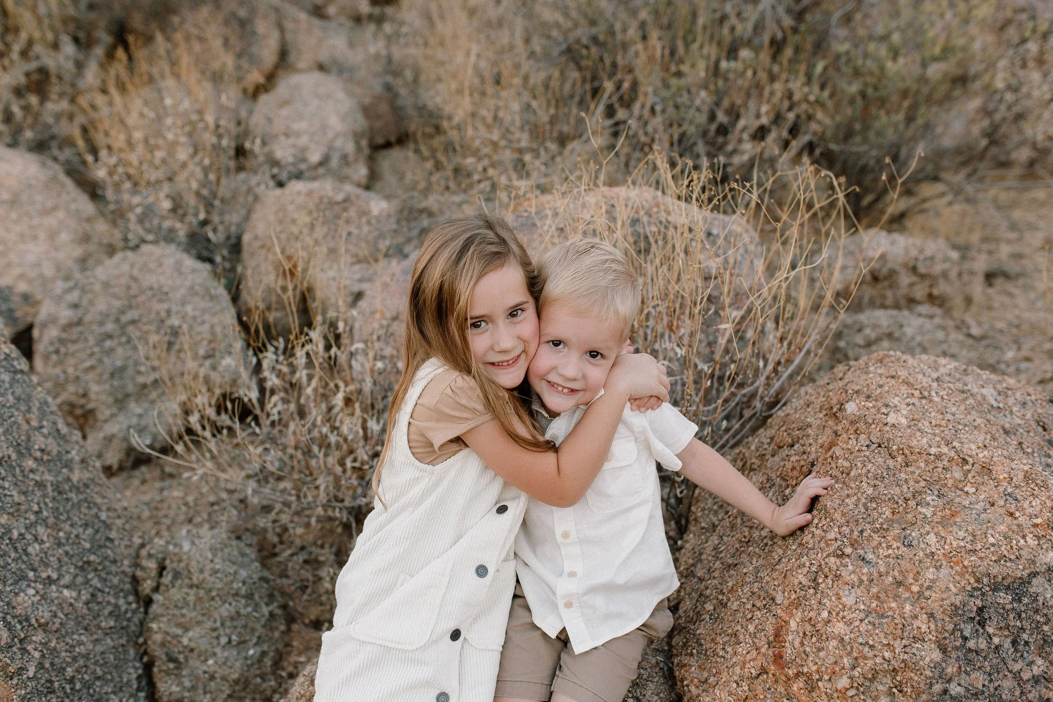 siblings hugging in desert family photography session in Scottsdale, Arizona