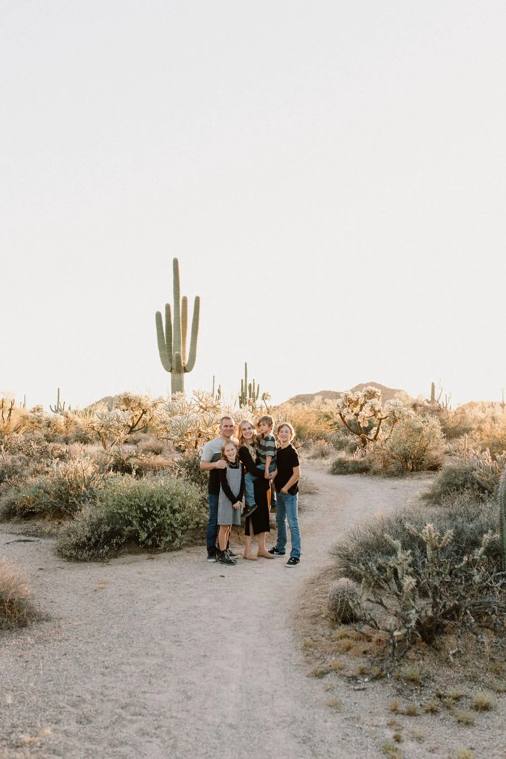 family photographer captures smiling family in Arizona desert session