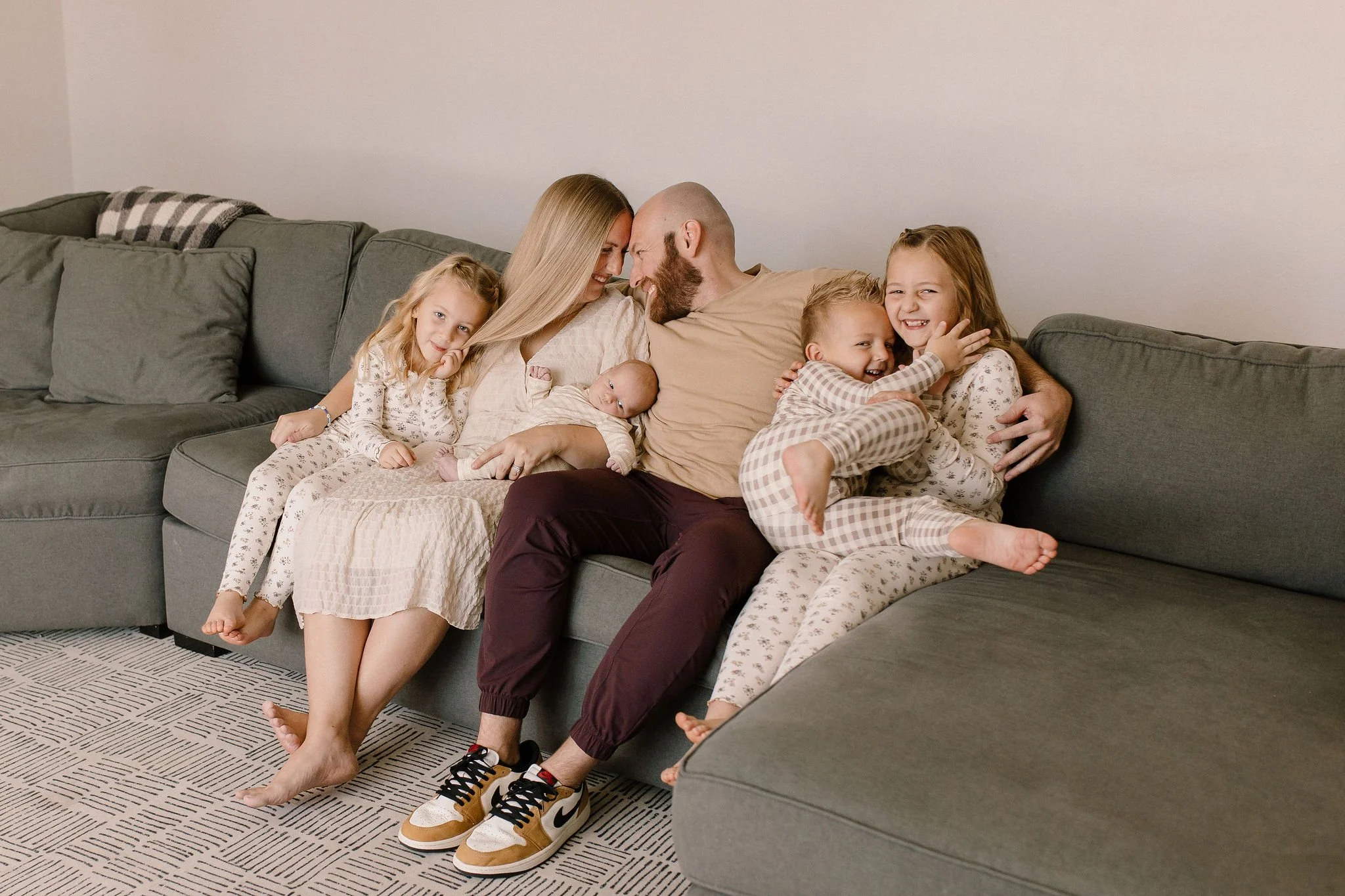 family holding newborn baby in Gilbert Arizona photography session