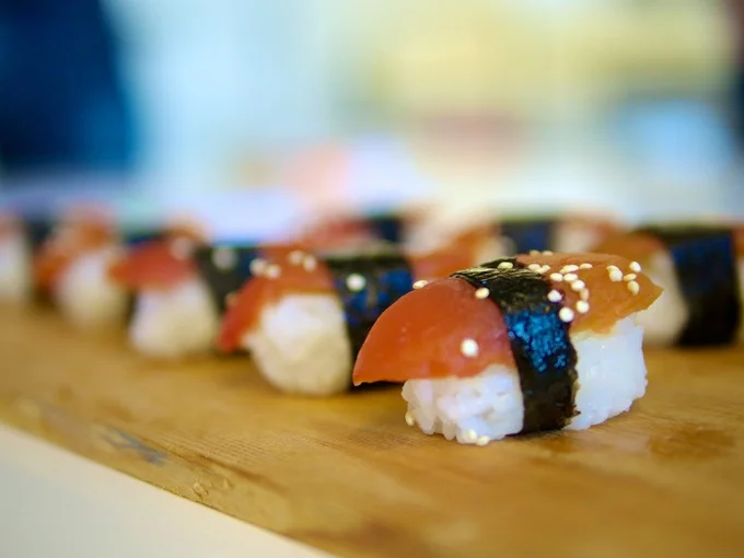 Ahimi served over rice, seaweed wrap and sesame seed garnish.