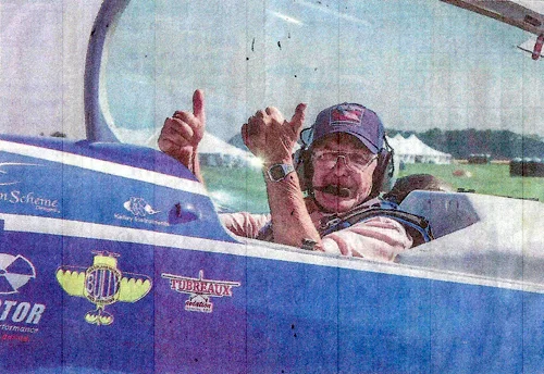 Ready for take-off . Korean War veteran Richard "Dick" Walters of Bath gives the thumbs-up before his flight with aerobatic pilot Rob Holland on Friday. The "Honor Flight" is a program Holland started to thank veterans.