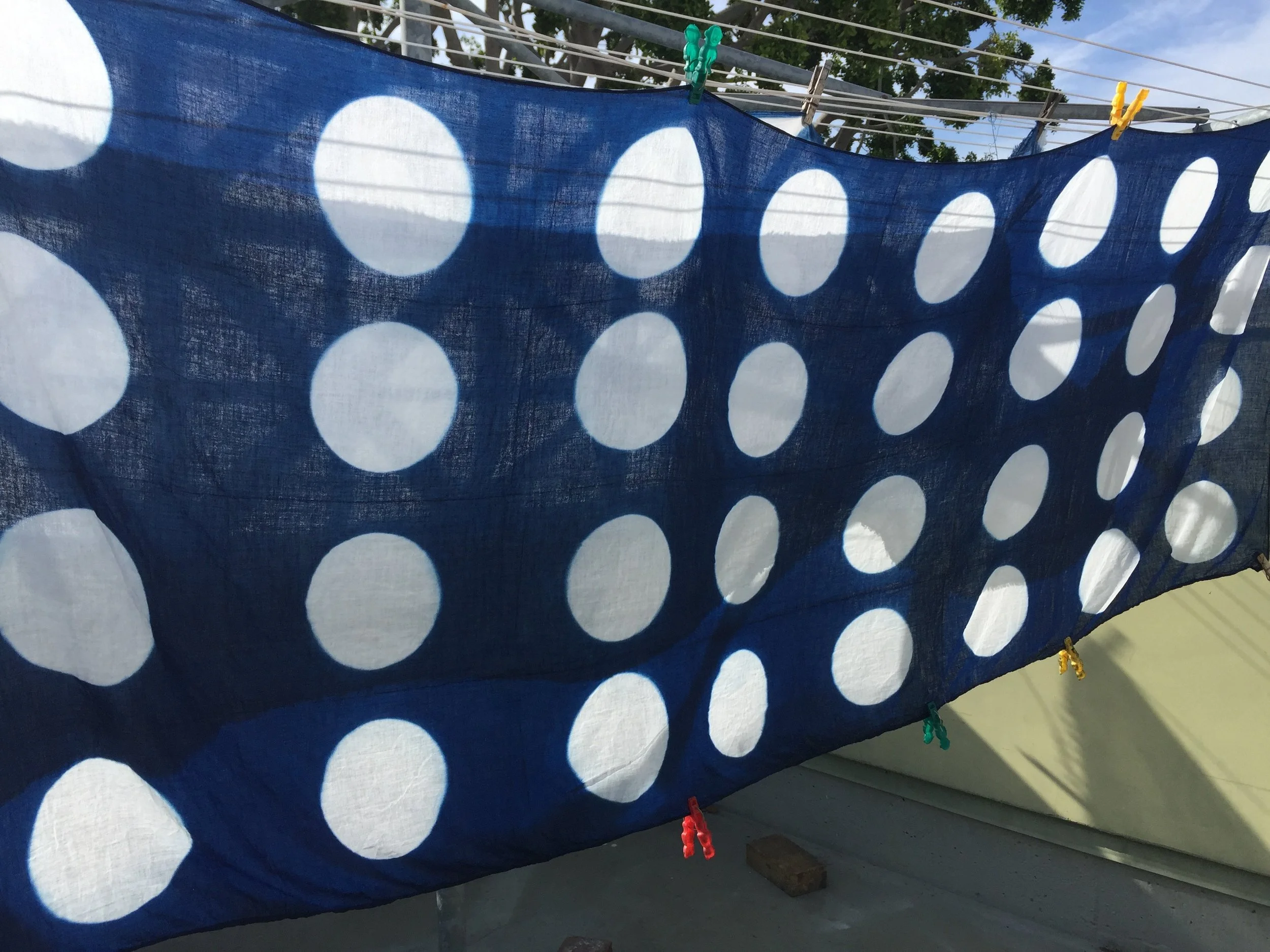 Shibori resist indigo dyed, use of wooden blocks to create pattern