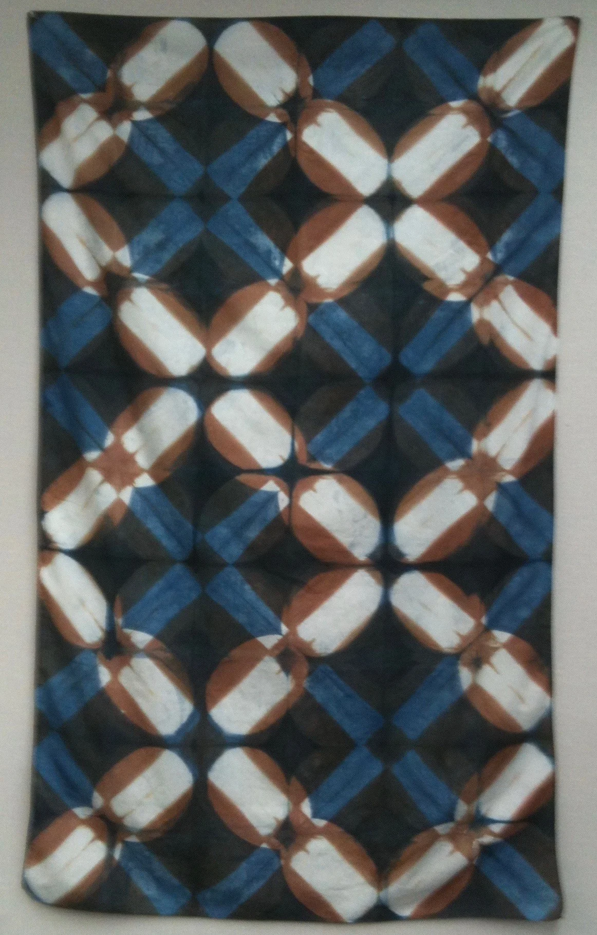 Shibori resist on cotton over-dyed