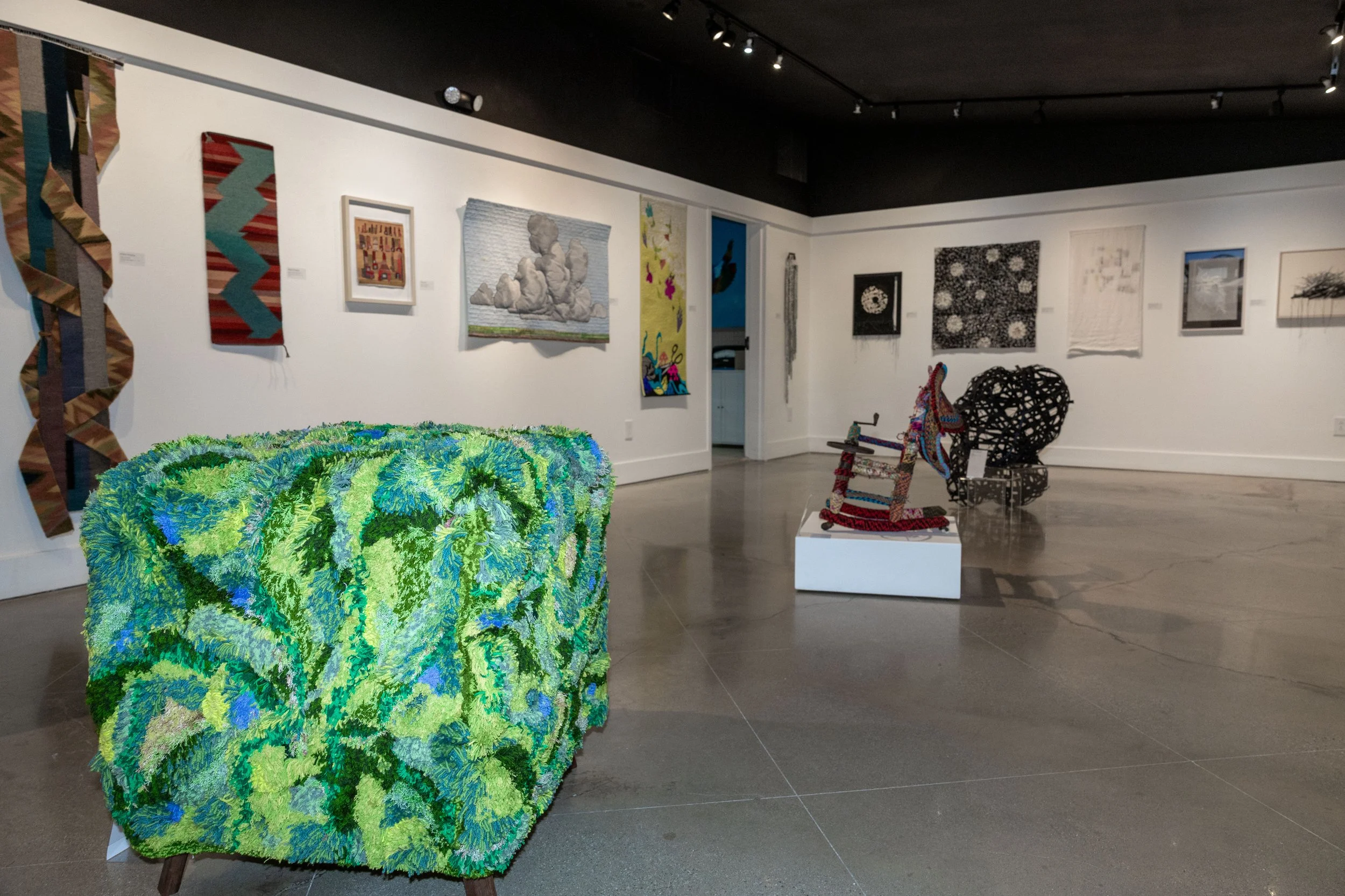 Eryn Young, foreground, tufted stool, 