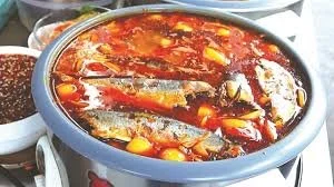 here is a pot of stewed sardines in tomato sauce from a street vendor destined to be made into banh mi.