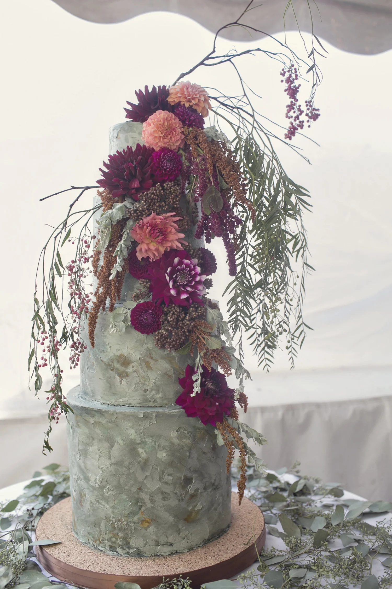 Textured buttercream cake with a dramatic floral arrangement. Photo by Heather Saunders Photography.