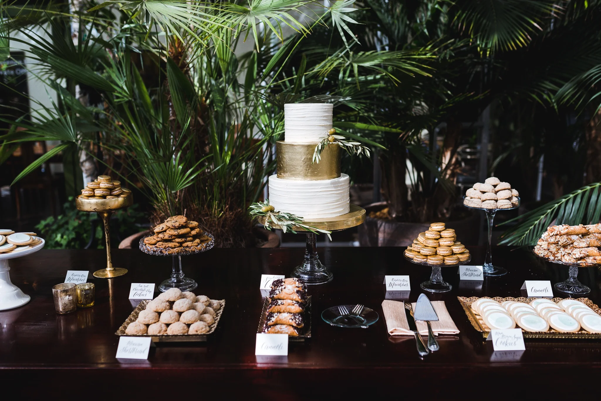 Chic garden wedding dessert table with three-tier wedding cake with gold detail. Photo by Rachel Liu Photography.