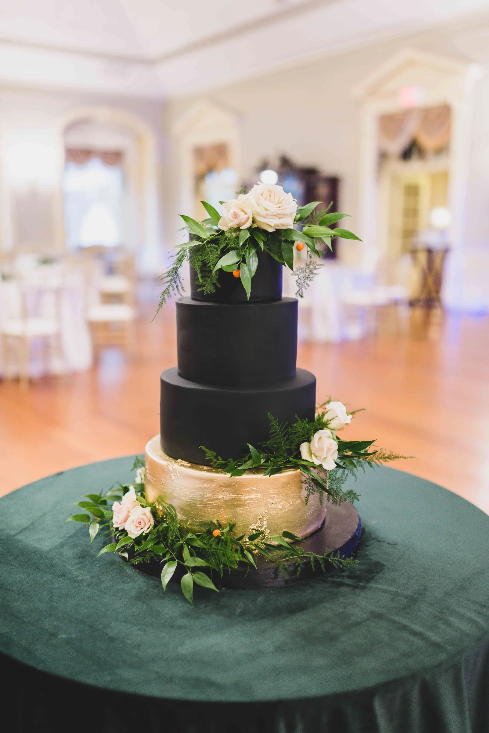 Black Wedding Cake with Gold Base and Fresh Flowers. Photo by Rachel Liu Photography.