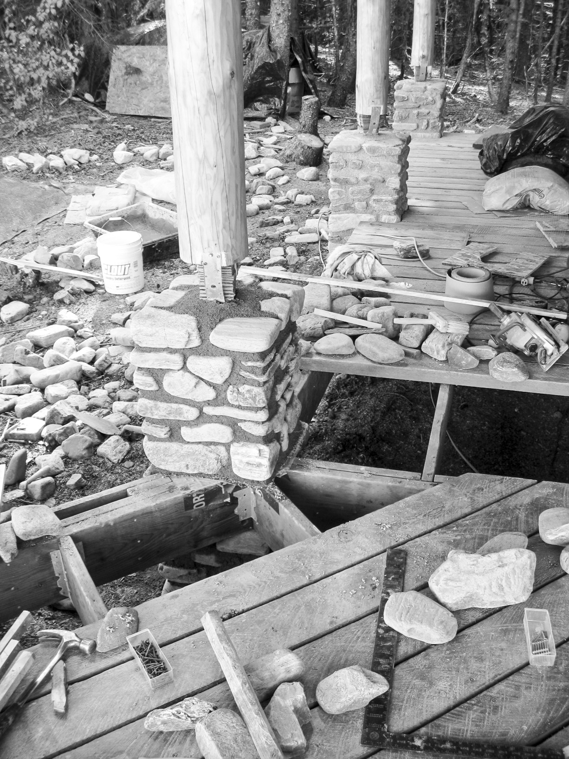 Stonework masonry and deck detail in the Off the Grid Haines Cabin by Farrell Homebuilding LLC in Alaska 