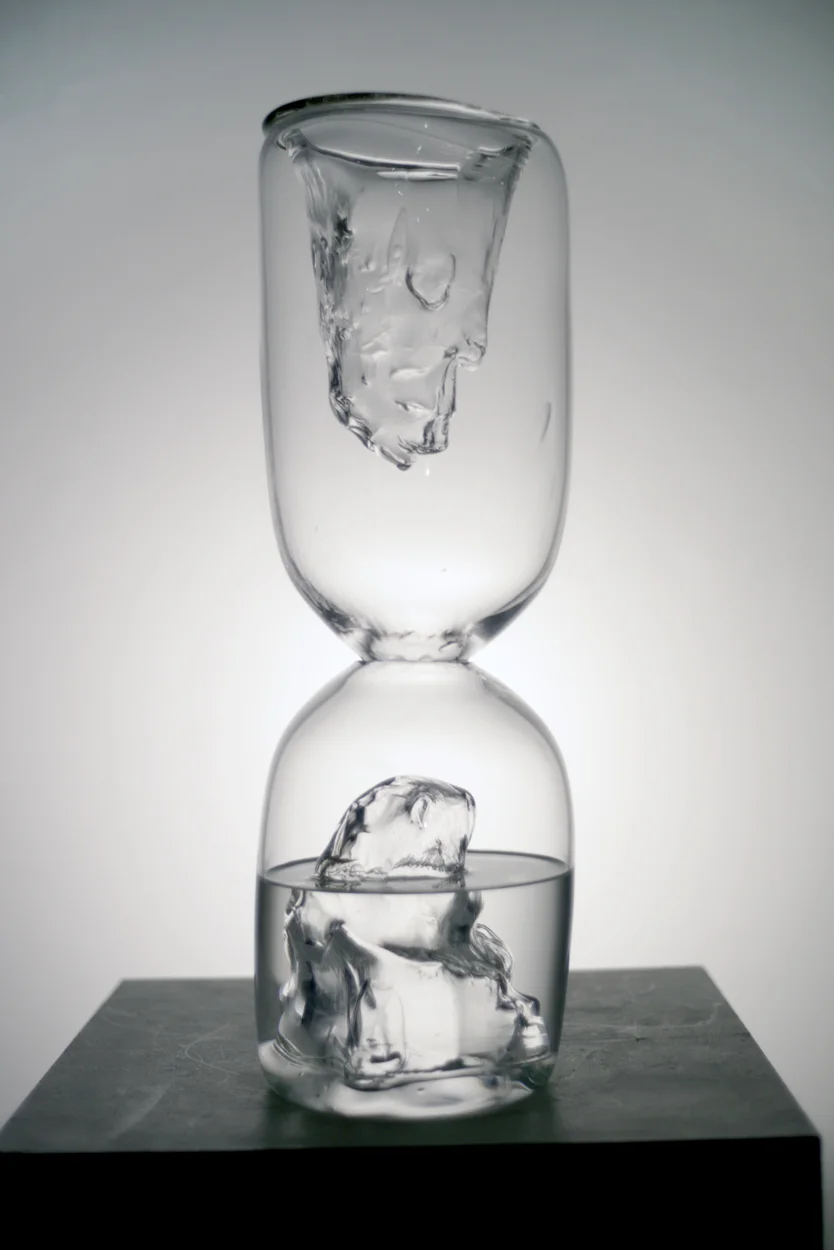 Sheltered Wish from the series InDecisive Moments , 2017. Hand-blown glass and water. 22 x 6 1/2 x 6 1/2"