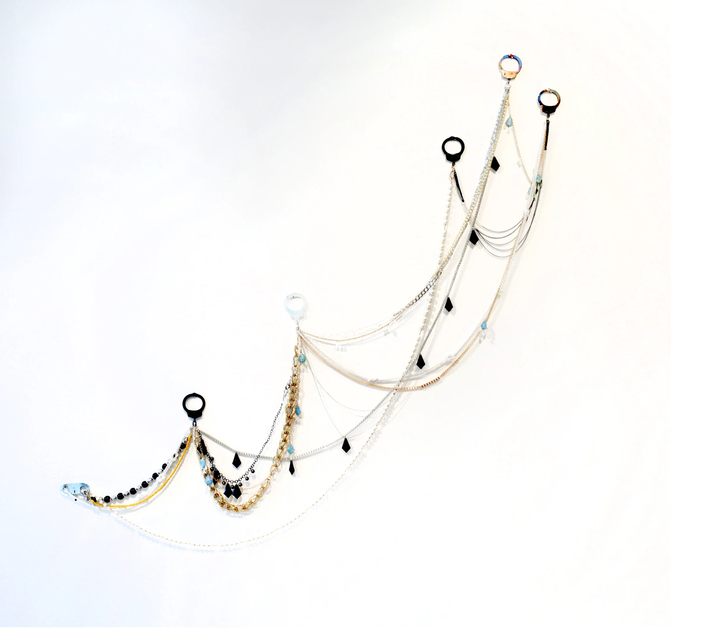    Solitaire   2017 Handcuffs and costume jewelry Variable dimensions 