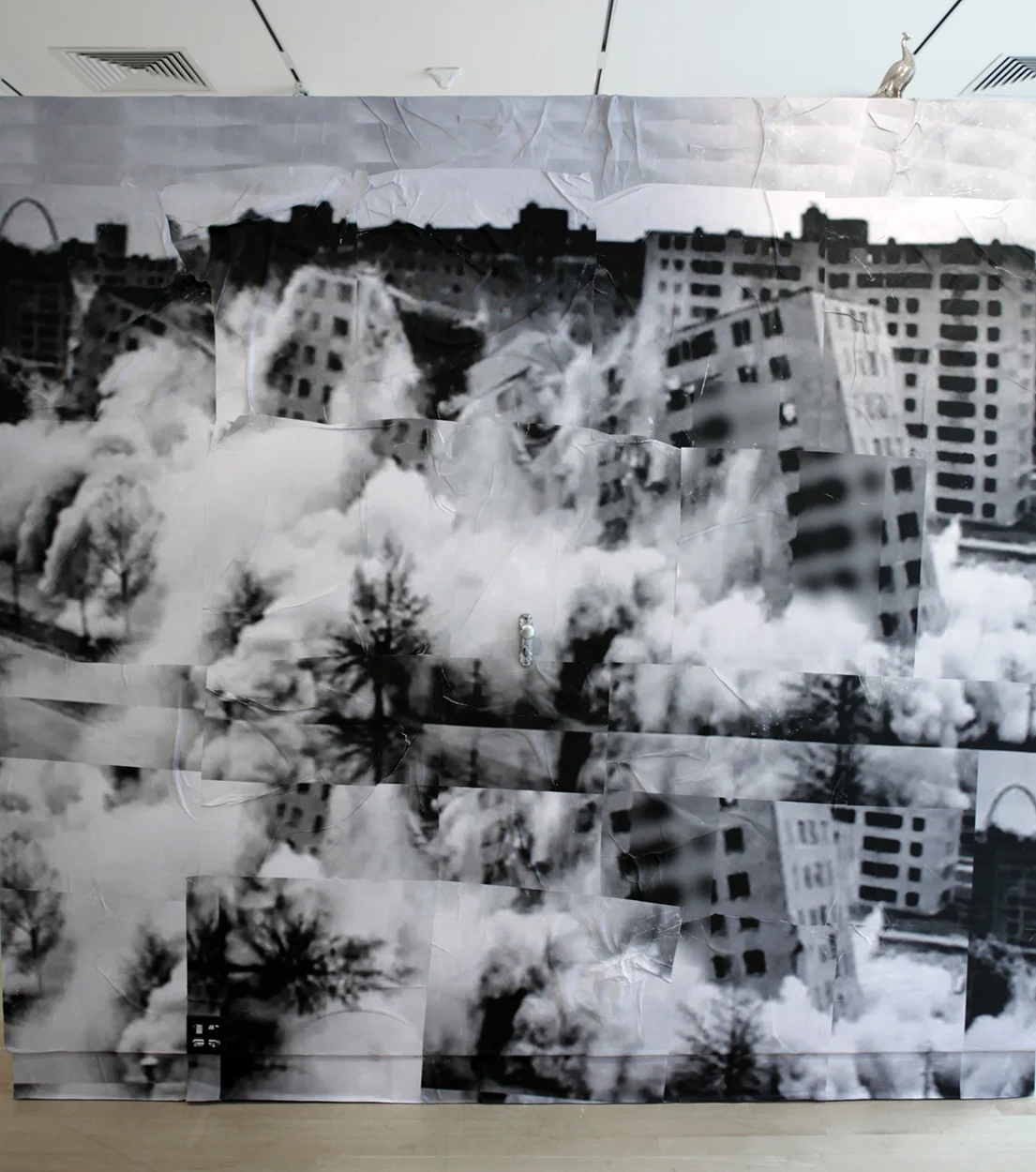 Ville Radieuse, habite-à-machine, 2017. Installation: 25 sheets of digitally printed paper, wheat paste, and found objects. 132 x 120"