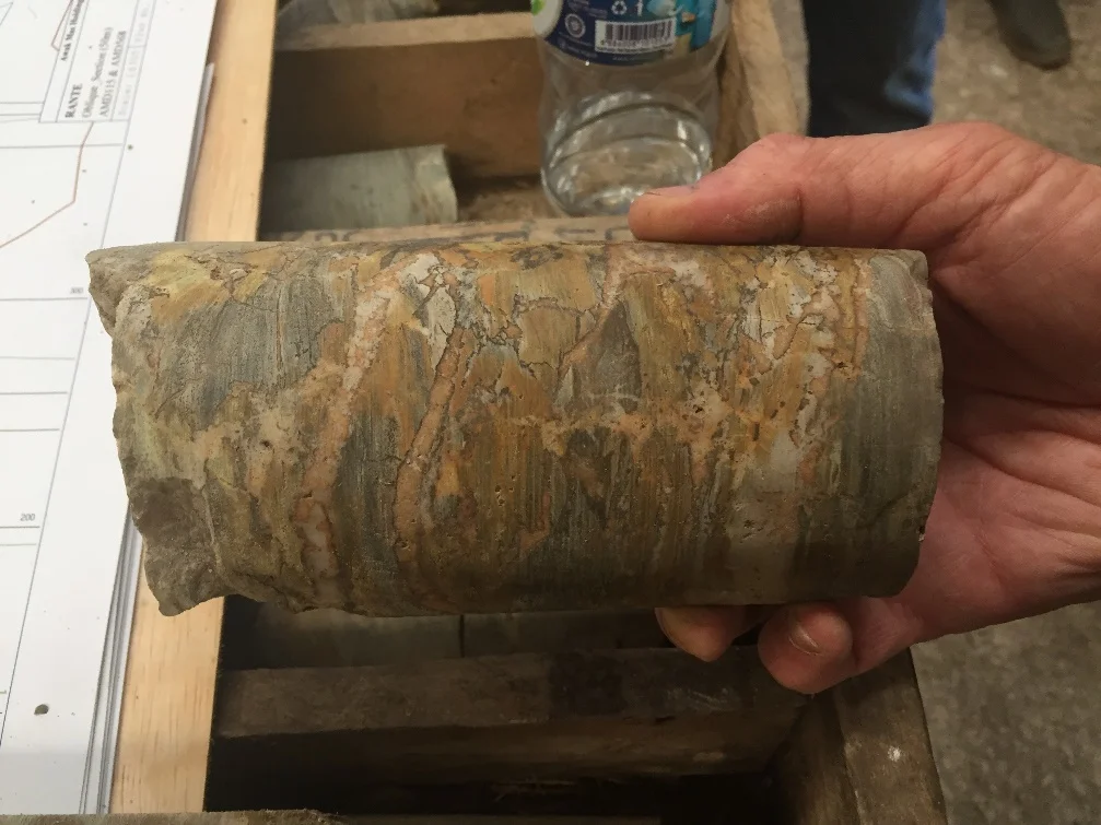 Hydrothermal breccia overprint on conformable veining