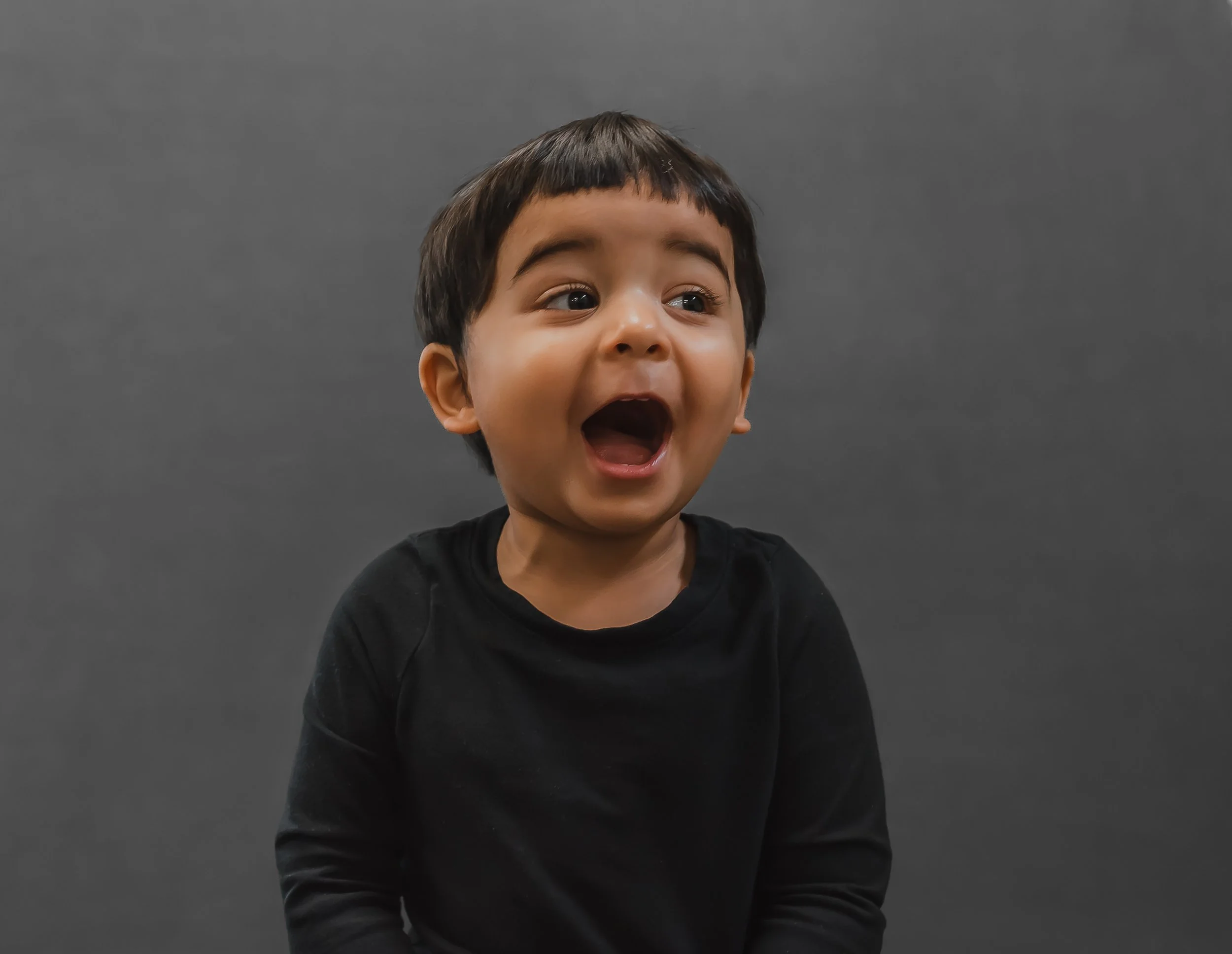 Natural school portrait of a toddler with expressive personality during photo day