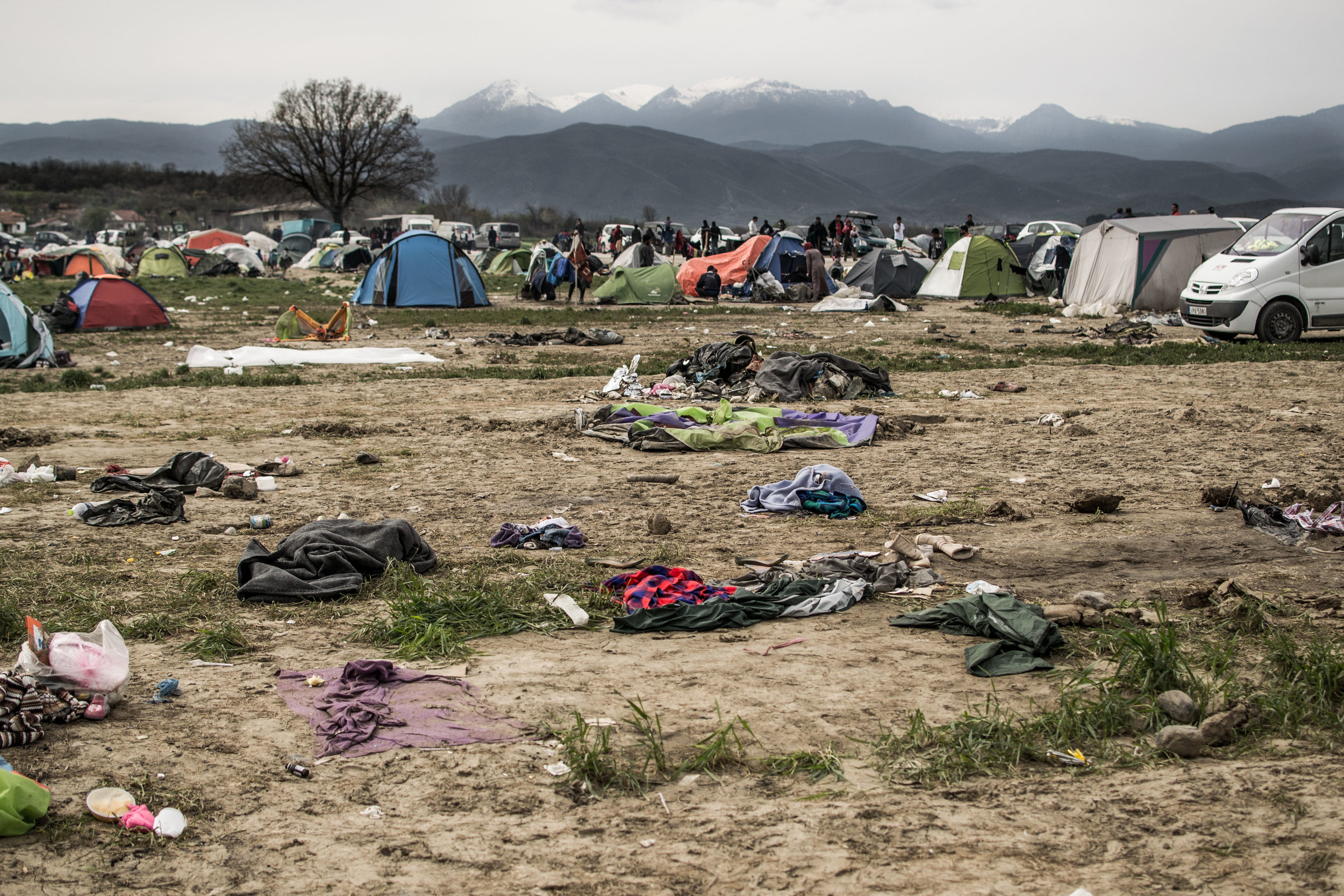 Unwanted items of clothing and camping paraphernalia litter the dry soil of the outskirts of Eidomeni. Large trucks would drive into the camp with heaps of donated clothes, and would be swamped by families grabbing what they could.