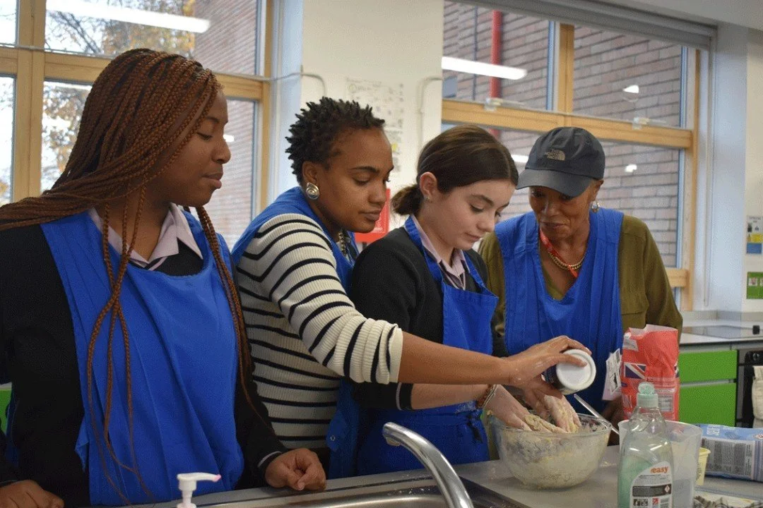 As part of our Black History Season, students got hands-on with Caribbean cooking 🍽️, making delicious plantain fritters from scratch&mdash;crispy, sweet, and a first-time hit for many!

They also enjoyed hair braiding workshops 💇🏽&zwj;♀️, picking