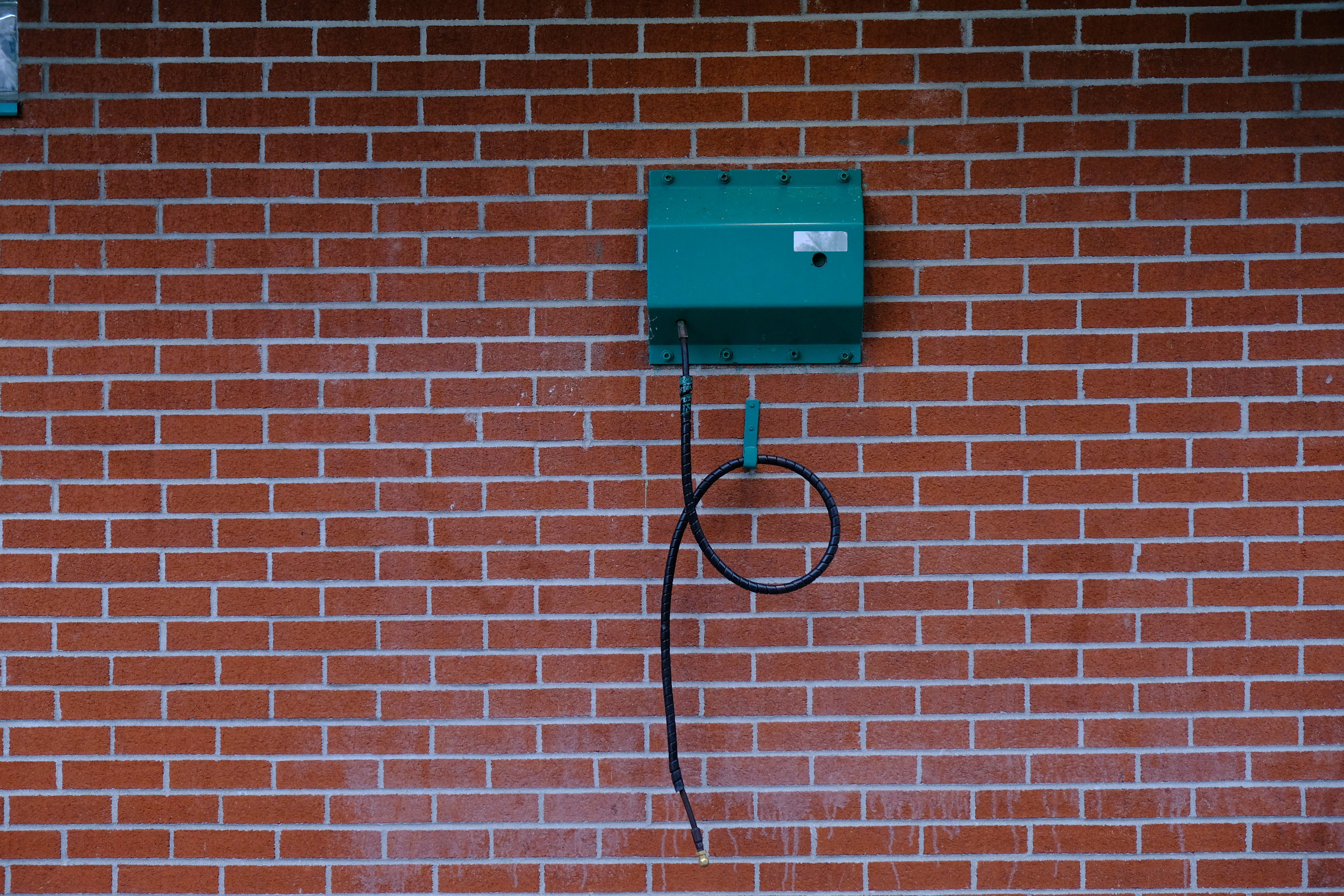  A bike pump attached to the wall of a public restroom in Candiac. 