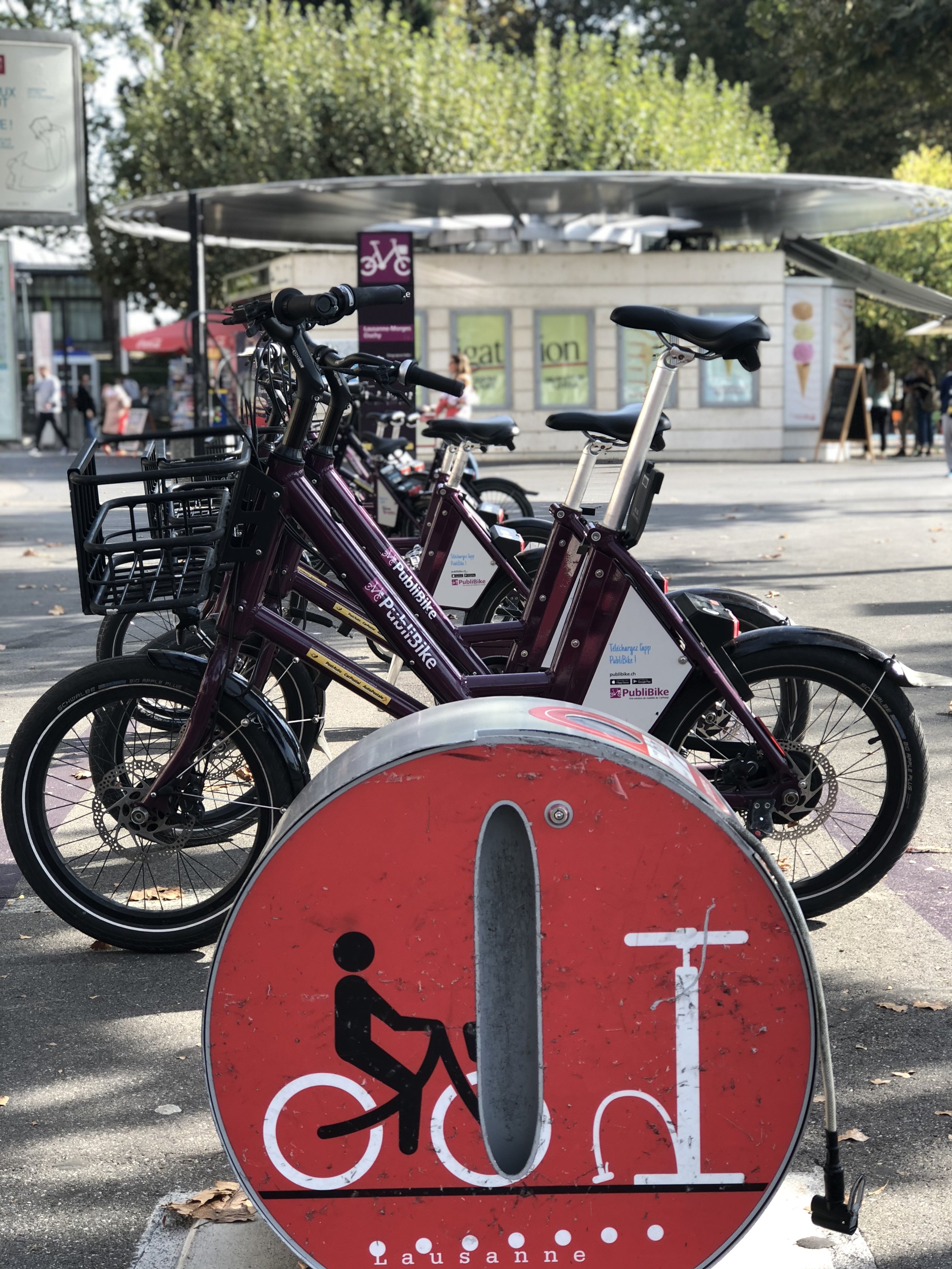  One of Lausanne’s bike share stations. Here, there is an air pump one can use by pushing the handle down by foot. 