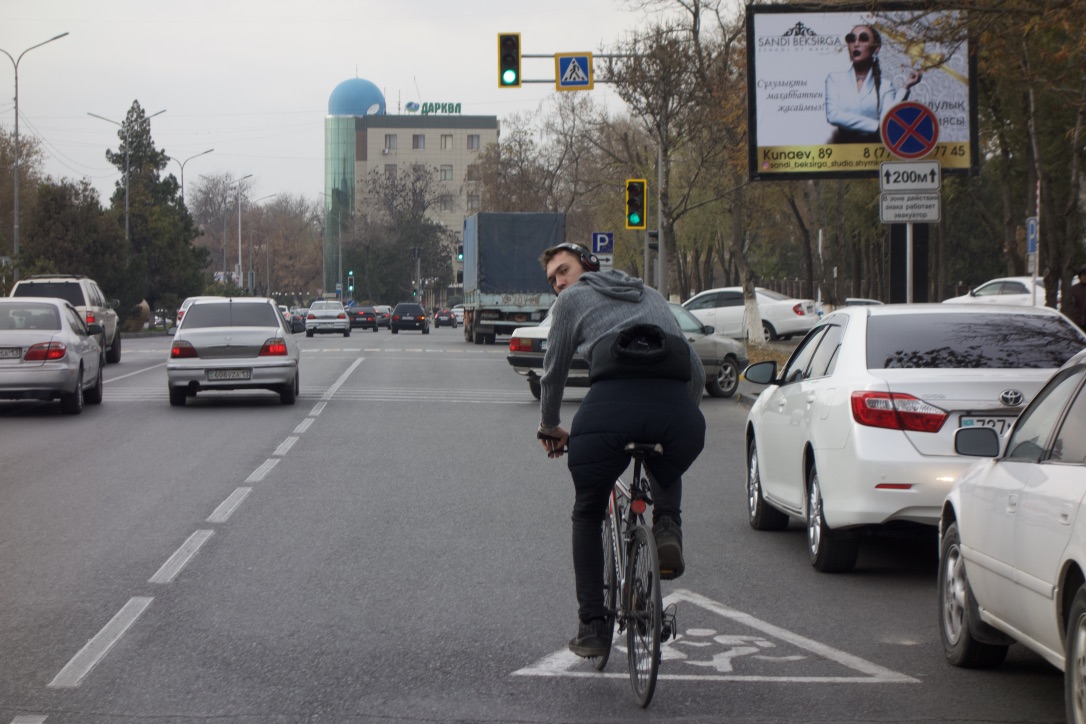  A local braves the wide, car-dominated streets of Shymkent. 